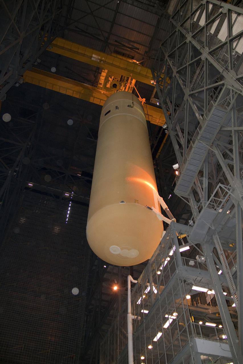 CAPE CANAVERAL, Fla. - In the Vehicle Assembly Building at NASA's Kennedy Space Center in Florida, the external fuel tank for space shuttle Atlantis' STS-132 mission, ET-136, is suspended over the transfer aisle. The external tank arrived at Kennedy from NASA's Michoud Assembly Facility on March 1 aboard the Pegasus barge. The six-member STS-132 crew will deliver an Integrated Cargo Carrier and a Russian-built Mini-Research Module, or MRM-1, to the International Space Station. Launch is targeted for May 14. For information on the STS-132 mission, visit http:__www.nasa.gov_mission_pages_shuttle_shuttlemissions_sts132_index.html. Photo credit: NASA_Jack Pfaller