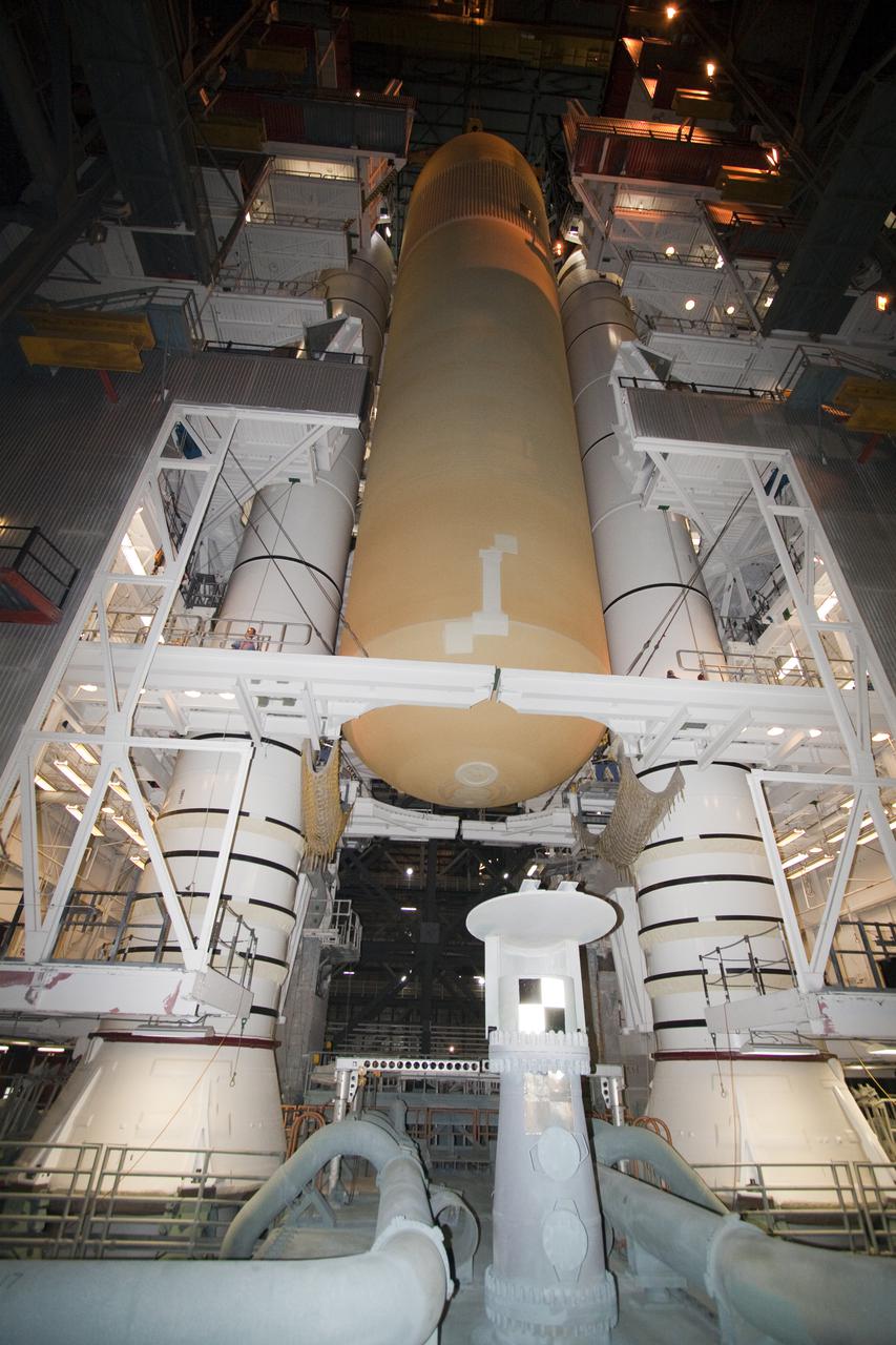 CAPE CANAVERAL, Fla. - In the Vehicle Assembly Building at NASA's Kennedy Space Center in Florida, the external fuel tank for space shuttle Atlantis' STS-132 mission, ET-136, is lowered for mating to the twin solid rocket boosters. The external tank arrived at Kennedy from NASA's Michoud Assembly Facility on March 1 aboard the Pegasus barge. The six-member STS-132 crew will deliver an Integrated Cargo Carrier and a Russian-built Mini-Research Module, or MRM-1, to the International Space Station. Launch is targeted for May 14. For information on the STS-132 mission, visit http:__www.nasa.gov_mission_pages_shuttle_shuttlemissions_sts132_index.html. Photo credit: NASA_Jack Pfaller