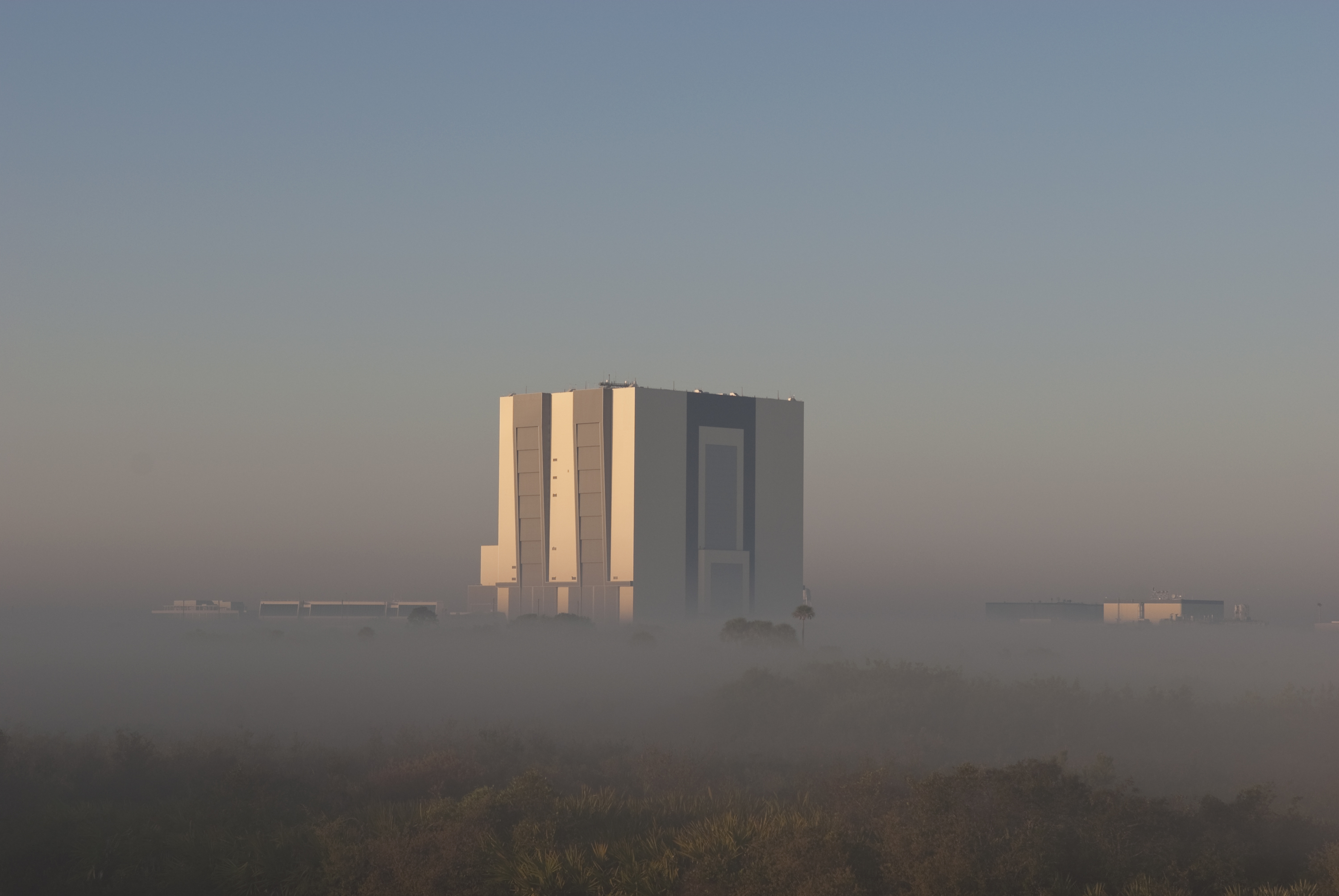 CAPE CANAVERAL, Fla. - Fog settles around the Vehicle Assembly Building at NASA's Kennedy Space Center in Florida three days before the planned liftoff of space shuttle Discovery on the STS-131 mission.  Weather conditions for launch at 6:21 a.m. EDT on April 5 are very favorable except for the possibility of early morning fog. On STS-131, the seven-member crew will deliver the multi-purpose logistics module Leonardo, filled with supplies, a new crew sleeping quarters and science racks that will be transferred to the International Space Station's laboratories.  The crew also will switch out a gyroscope on the station’s truss, install a spare ammonia storage tank and retrieve a Japanese experiment from the station’s exterior.  STS-131 is the 33rd shuttle mission to the station and the 131st shuttle mission overall. For information on the STS-131 mission and crew, visit http:__www.nasa.gov_mission_pages_shuttle_shuttlemissions_sts131_index.html.  Photo credit: NASA_Jim Grossmann