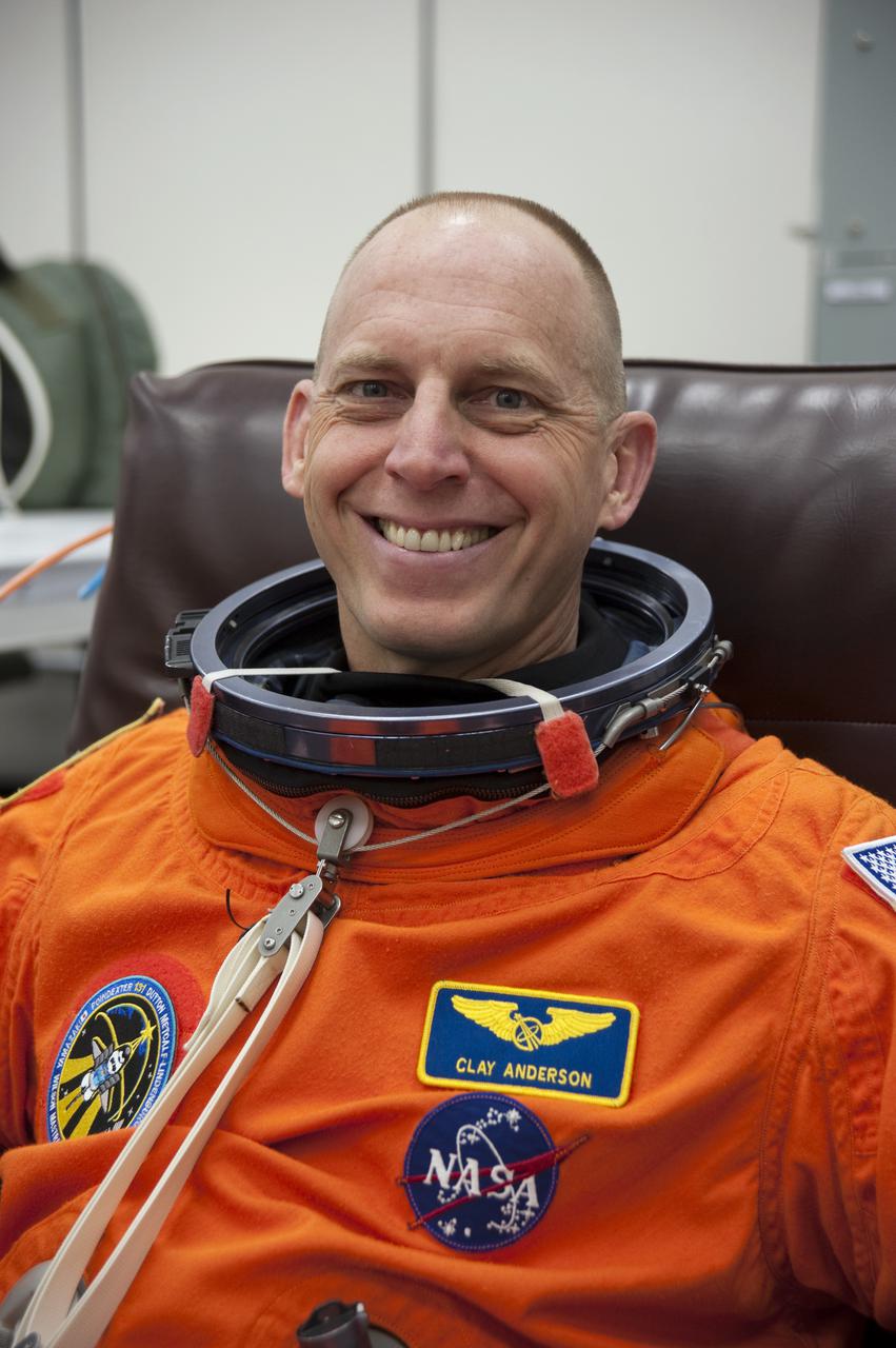CAPE CANAVERAL, Fla. - In the Operations and Checkout Building at NASA's Kennedy Space Center in Florida, the astronauts of space shuttle Discovery's STS-131 crew put on their launch-and-entry suits before heading to the Astrovan for the ride to Launch Pad 39A.  Mission Specialist Clayton Anderson, seen here, is dressed for launch.  Liftoff of the STS-131 mission is set for 6:21 a.m. EDT on April 5. On STS-131, the seven-member crew will deliver the multi-purpose logistics module Leonardo, filled with supplies, a new crew sleeping quarters and science racks that will be transferred to the International Space Station's laboratories.  The crew also will switch out a gyroscope on the station’s truss, install a spare ammonia storage tank and retrieve a Japanese experiment from the station’s exterior.  STS-131 is the 33rd shuttle mission to the station and the 131st shuttle mission overall. For information on the STS-131 mission and crew, visit http:__www.nasa.gov_mission_pages_shuttle_shuttlemissions_sts131_index.html.  Photo credit: NASA_Kim Shiflett