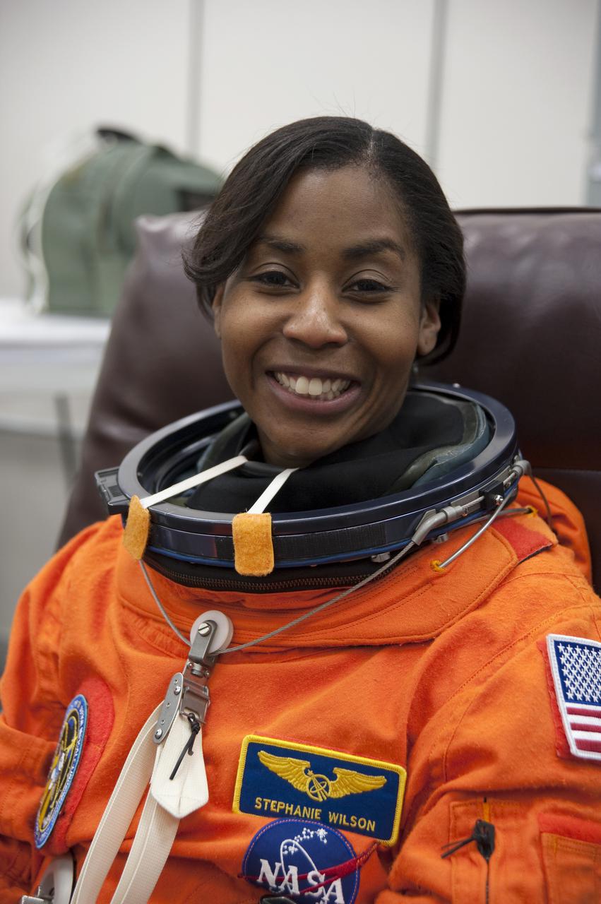 CAPE CANAVERAL, Fla. - In the Operations and Checkout Building at NASA's Kennedy Space Center in Florida, the astronauts of space shuttle Discovery's STS-131 crew put on their launch-and-entry suits before heading to the Astrovan for the ride to Launch Pad 39A.  Mission Specialist Stephanie Wilson, seen here, is dressed for launch.  Liftoff of the STS-131 mission is set for 6:21 a.m. EDT on April 5. On STS-131, the seven-member crew will deliver the multi-purpose logistics module Leonardo, filled with supplies, a new crew sleeping quarters and science racks that will be transferred to the International Space Station's laboratories.  The crew also will switch out a gyroscope on the station’s truss, install a spare ammonia storage tank and retrieve a Japanese experiment from the station’s exterior.  STS-131 is the 33rd shuttle mission to the station and the 131st shuttle mission overall. For information on the STS-131 mission and crew, visit http:__www.nasa.gov_mission_pages_shuttle_shuttlemissions_sts131_index.html.  Photo credit: NASA_Kim Shiflett