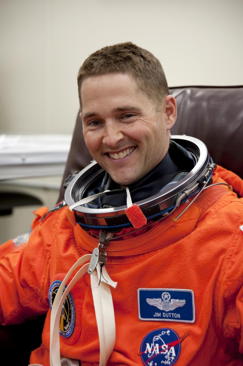 CAPE CANAVERAL, Fla. - In the Operations and Checkout Building at NASA's Kennedy Space Center in Florida, the astronauts of space shuttle Discovery's STS-131 crew put on their launch-and-entry suits before heading to the Astrovan for the ride to Launch Pad 39A.  Pilot James P. Dutton Jr., seen here, is dressed for launch.  Liftoff of the STS-131 mission is set for 6:21 a.m. EDT on April 5. On STS-131, the seven-member crew will deliver the multi-purpose logistics module Leonardo, filled with supplies, a new crew sleeping quarters and science racks that will be transferred to the International Space Station's laboratories.  The crew also will switch out a gyroscope on the station’s truss, install a spare ammonia storage tank and retrieve a Japanese experiment from the station’s exterior.  STS-131 is the 33rd shuttle mission to the station and the 131st shuttle mission overall. For information on the STS-131 mission and crew, visit http:__www.nasa.gov_mission_pages_shuttle_shuttlemissions_sts131_index.html.  Photo credit: NASA_Kim Shiflett