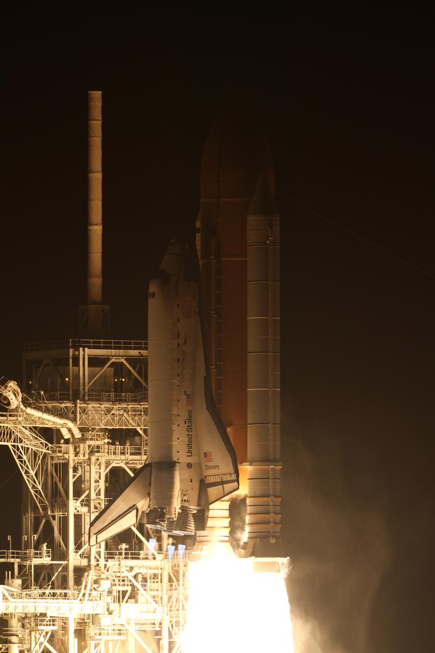 CAPE CANAVERAL, Fla. - Engine ignition on space shuttle Discovery illuminates the lightning mast atop the fixed service structure on Launch Pad 39A at NASA's Kennedy Space Center in Florida. Discovery launched at 6:21 a.m. EDT April 5 on the STS-131 mission. The seven-member crew will deliver the multi-purpose logistics module Leonardo, filled with supplies, a new crew sleeping quarters and science racks that will be transferred to the International Space Station's laboratories. The crew also will switch out a gyroscope on the station’s truss, install a spare ammonia storage tank and retrieve a Japanese experiment from the station’s exterior. STS-131 is the 33rd shuttle mission to the station and the 131st shuttle mission overall. For information on the STS-131 mission and crew, visit http:__www.nasa.gov_mission_pages_shuttle_shuttlemissions_sts131_index.html. Photo credit: NASA_Kenny Allen
