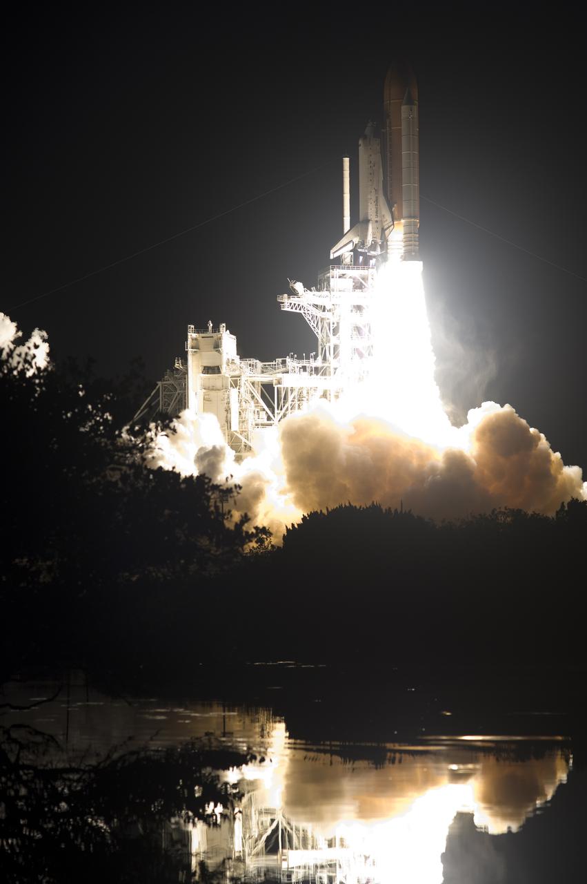 CAPE CANAVERAL, Fla. - The brilliance of space shuttle Discovery's liftoff at NASA's Kennedy Space Center in Florida is reflected in the water near Launch Pad 39A. Liftoff on the STS-131 mission was on time at 6:21 a.m. EDT.  The seven-member crew will deliver the multi-purpose logistics module Leonardo, filled with supplies, a new crew sleeping quarters and science racks that will be transferred to the International Space Station's laboratories.  The crew also will switch out a gyroscope on the station’s truss, install a spare ammonia storage tank and retrieve a Japanese experiment from the station’s exterior.  STS-131 is the 33rd shuttle mission to the station and the 131st shuttle mission overall. For information on the STS-131 mission and crew, visit http:__www.nasa.gov_mission_pages_shuttle_shuttlemissions_sts131_index.html.  Photo credit: NASA_Sandra Joseph and Kevin O'Connell