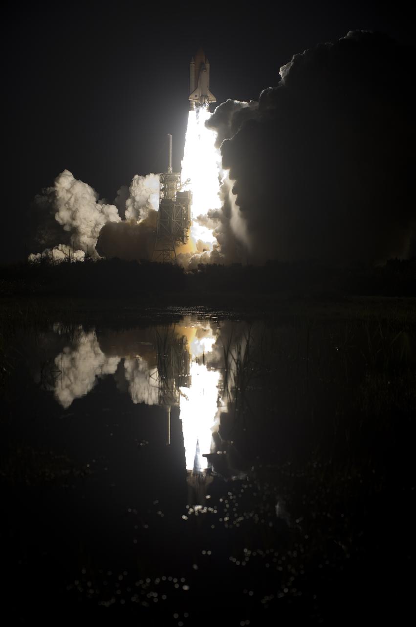CAPE CANAVERAL, Fla. - The brilliance of space shuttle Discovery's liftoff at NASA's Kennedy Space Center in Florida is reflected in the water near Launch Pad 39A. Liftoff on the STS-131 mission was on time at 6:21 a.m. EDT. The seven-member crew will deliver the multi-purpose logistics module Leonardo, filled with supplies, a new crew sleeping quarters and science racks that will be transferred to the International Space Station's laboratories. The crew also will switch out a gyroscope on the station’s truss, install a spare ammonia storage tank and retrieve a Japanese experiment from the station’s exterior. STS-131 is the 33rd shuttle mission to the station and the 131st shuttle mission overall. For information on the STS-131 mission and crew, visit http:__www.nasa.gov_mission_pages_shuttle_shuttlemissions_sts131_index.html. Photo credit: NASA_Tony Gray and Tom Farrar
