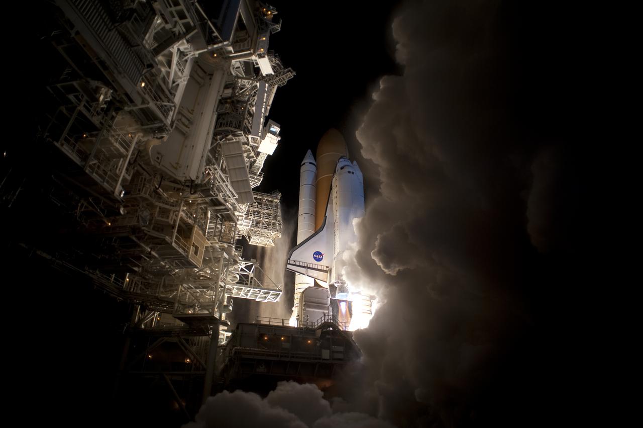 CAPE CANAVERAL, Fla. - An exhaust cloud threatens to obscure the view of space shuttle Discovery as it hurtles toward space after liftoff from Launch Pad 39A at NASA's Kennedy Space Center in Florida. Launch on the STS-131 mission was on time at 6:21 a.m. EDT. The seven-member crew will deliver the multi-purpose logistics module Leonardo, filled with supplies, a new crew sleeping quarters and science racks that will be transferred to the International Space Station's laboratories. The crew also will switch out a gyroscope on the station’s truss, install a spare ammonia storage tank and retrieve a Japanese experiment from the station’s exterior. STS-131 is the 33rd shuttle mission to the station and the 131st shuttle mission overall. For information on the STS-131 mission and crew, visit http:__www.nasa.gov_mission_pages_shuttle_shuttlemissions_sts131_index.html. Photo credit: NASA_Tony Gray and Tom Farrar