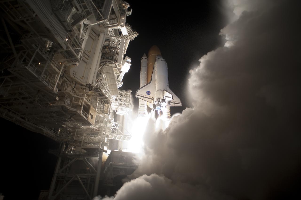 CAPE CANAVERAL, Fla. - An exhaust cloud billows around Launch Pad 39A at NASA's Kennedy Space Center in Florida as space shuttle Discovery lifts off at 6:21 a.m. EDT April 5 to begin the STS-131 mission. The seven-member crew will deliver the multi-purpose logistics module Leonardo, filled with supplies, a new crew sleeping quarters and science racks that will be transferred to the International Space Station's laboratories. The crew also will switch out a gyroscope on the station’s truss, install a spare ammonia storage tank and retrieve a Japanese experiment from the station’s exterior. STS-131 is the 33rd shuttle mission to the station and the 131st shuttle mission overall. For information on the STS-131 mission and crew, visit http:__www.nasa.gov_mission_pages_shuttle_shuttlemissions_sts131_index.html. Photo credit: NASA_Tony Gray and Tom Farrar