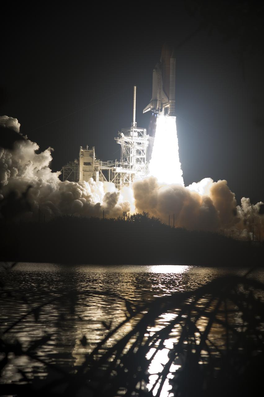 CAPE CANAVERAL, Fla. - Space shuttle Discovery rises above the exhaust cloud forming at Launch Pad 39A at NASA's Kennedy Space Center in Florida as it begins its climb to orbit at 6:21 a.m. EDT April 5 on the STS-131 mission.  The seven-member crew will deliver the multi-purpose logistics module Leonardo, filled with supplies, a new crew sleeping quarters and science racks that will be transferred to the International Space Station's laboratories.  The crew also will switch out a gyroscope on the station’s truss, install a spare ammonia storage tank and retrieve a Japanese experiment from the station’s exterior.  STS-131 is the 33rd shuttle mission to the station and the 131st shuttle mission overall. For information on the STS-131 mission and crew, visit http:__www.nasa.gov_mission_pages_shuttle_shuttlemissions_sts131_index.html.  Photo credit: NASA_Sandra Joseph and Kevin O'Connell