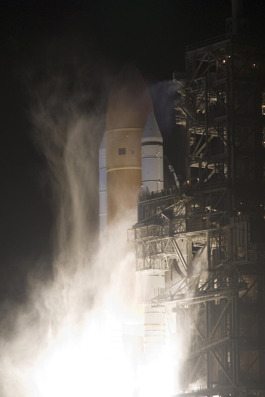 CAPE CANAVERAL, Fla. - An exhaust cloud begins to form at Launch Pad 39A at NASA's Kennedy Space Center in Florida as space shuttle Discovery lifts off on the STS-131 mission at 6:21 a.m. EDT April 5.  The seven-member crew will deliver the multi-purpose logistics module Leonardo, filled with supplies, a new crew sleeping quarters and science racks that will be transferred to the International Space Station's laboratories.  The crew also will switch out a gyroscope on the station’s truss, install a spare ammonia storage tank and retrieve a Japanese experiment from the station’s exterior.  STS-131 is the 33rd shuttle mission to the station and the 131st shuttle mission overall. For information on the STS-131 mission and crew, visit http:__www.nasa.gov_mission_pages_shuttle_shuttlemissions_sts131_index.html.  Photo credit: NASA_Rusty Backer and Michael Gayle