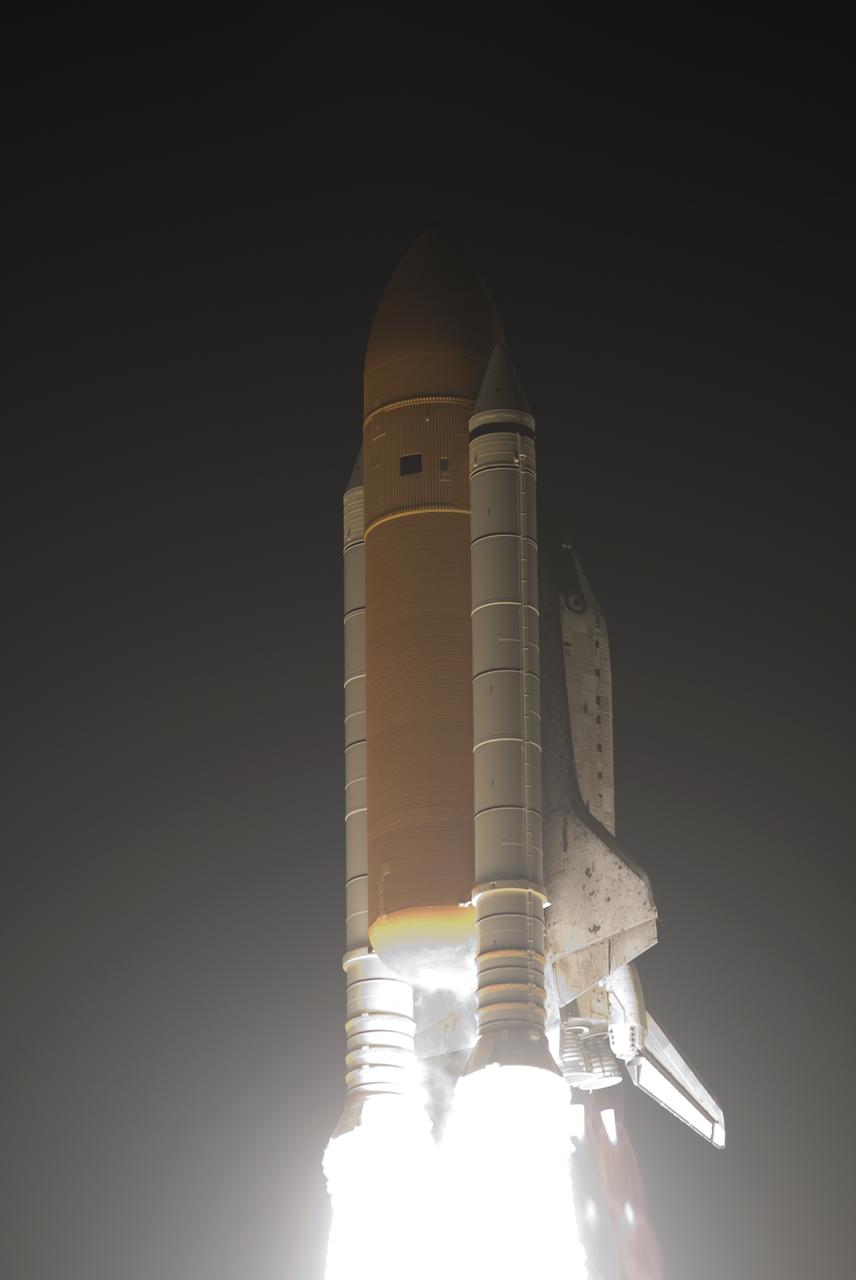 CAPE CANAVERAL, Fla. - The light from the solid rocket boosters and main engines of space shuttle Discovery is dazzling as the shuttle rushes into the predawn sky over Launch Pad 39A at NASA's Kennedy Space Center.  Liftoff on the STS-131 mission was on time at 6:21 a.m. EDT April 5.  The seven-member crew will deliver the multi-purpose logistics module Leonardo, filled with supplies, a new crew sleeping quarters and science racks that will be transferred to the International Space Station's laboratories.  The crew also will switch out a gyroscope on the station’s truss, install a spare ammonia storage tank and retrieve a Japanese experiment from the station’s exterior.  STS-131 is the 33rd shuttle mission to the station and the 131st shuttle mission overall. For information on the STS-131 mission and crew, visit http:__www.nasa.gov_mission_pages_shuttle_shuttlemissions_sts131_index.html.  Photo credit: NASA_Rusty Backer and Michael Gayle