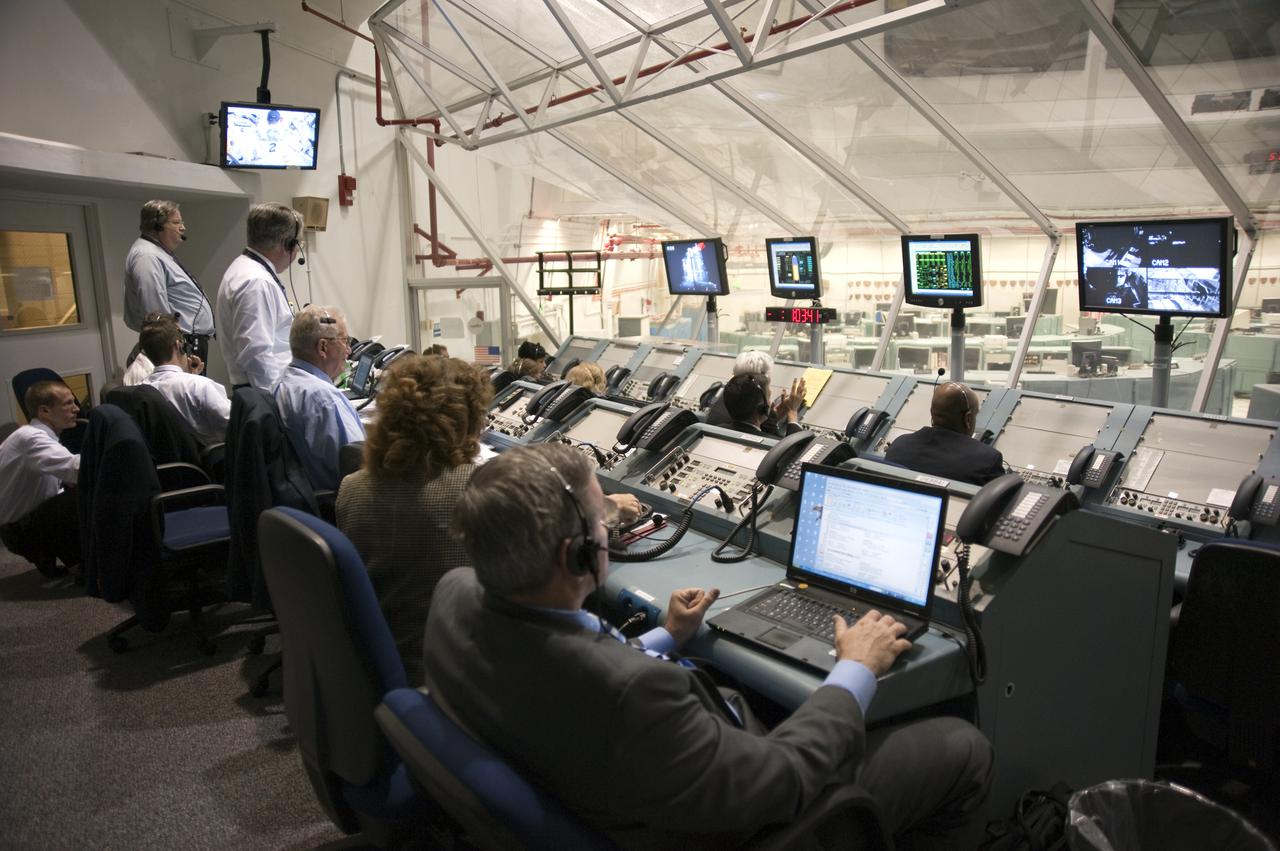 CAPE CANAVERAL, Fla.  - In Firing Room 4 of the Launch Control Center at NASA's Kennedy Space Center in Florida, NASA managers monitor the countdown to launch of space shuttle Discovery's STS-131 mission.  Shuttle Discovery lifted off at 6:21 a.m. EDT on April 5, 2010. The seven-member STS-131 crew will deliver the multi-purpose logistics module Leonardo, filled with supplies, a new crew sleeping quarters and science racks that will be transferred to the International Space Station's laboratories. The crew also will switch out a gyroscope on the station’s truss, install a spare ammonia storage tank and retrieve a Japanese experiment from the station’s exterior. STS-131 is the 33rd shuttle mission to the station and the 131st shuttle mission overall. For information on the STS-131 mission and crew, visit http:__www.nasa.gov_mission_pages_shuttle_shuttlemissions_sts131_index.html. Photo credit: NASA_Kim Shiflett