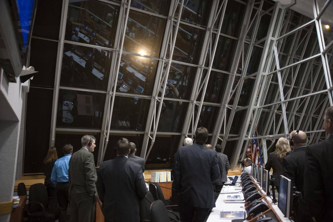 CAPE CANAVERAL, Fla.  - NASA officials watch the liftoff of space shuttle Discovery through the windows of Firing Room 4 in the Launch Control Center at NASA's Kennedy Space Center in Florida.  Shuttle Discovery lifted off at 6:21 a.m. EDT on April 5, 2010. The seven-member STS-131 crew will deliver the multi-purpose logistics module Leonardo, filled with supplies, a new crew sleeping quarters and science racks that will be transferred to the International Space Station's laboratories. The crew also will switch out a gyroscope on the station’s truss, install a spare ammonia storage tank and retrieve a Japanese experiment from the station’s exterior. STS-131 is the 33rd shuttle mission to the station and the 131st shuttle mission overall. For information on the STS-131 mission and crew, visit http:__www.nasa.gov_mission_pages_shuttle_shuttlemissions_sts131_index.html. Photo credit: NASA_Kim Shiflett