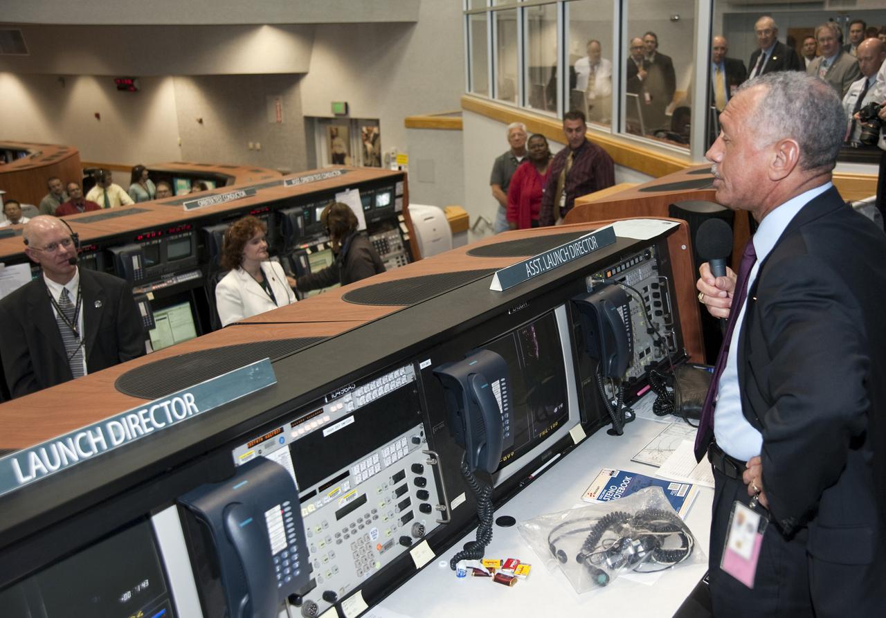 CAPE CANAVERAL, Fla.  - NASA Administrator Charles Bolden congratulates the team in NASA Kennedy Space Center's Launch Control Center after space shuttle Discovery's majestic launch on the STS-131 mission. Seen in the left background is Steve Payne, shuttle test director.  Shuttle Discovery lifted off at 6:21 a.m. EDT on April 5, 2010. The seven-member STS-131 crew will deliver the multi-purpose logistics module Leonardo, filled with supplies, a new crew sleeping quarters and science racks that will be transferred to the International Space Station's laboratories. The crew also will switch out a gyroscope on the station’s truss, install a spare ammonia storage tank and retrieve a Japanese experiment from the station’s exterior. STS-131 is the 33rd shuttle mission to the station and the 131st shuttle mission overall. For information on the STS-131 mission and crew, visit http:__www.nasa.gov_mission_pages_shuttle_shuttlemissions_sts131_index.html. Photo credit: NASA_Kim Shiflett