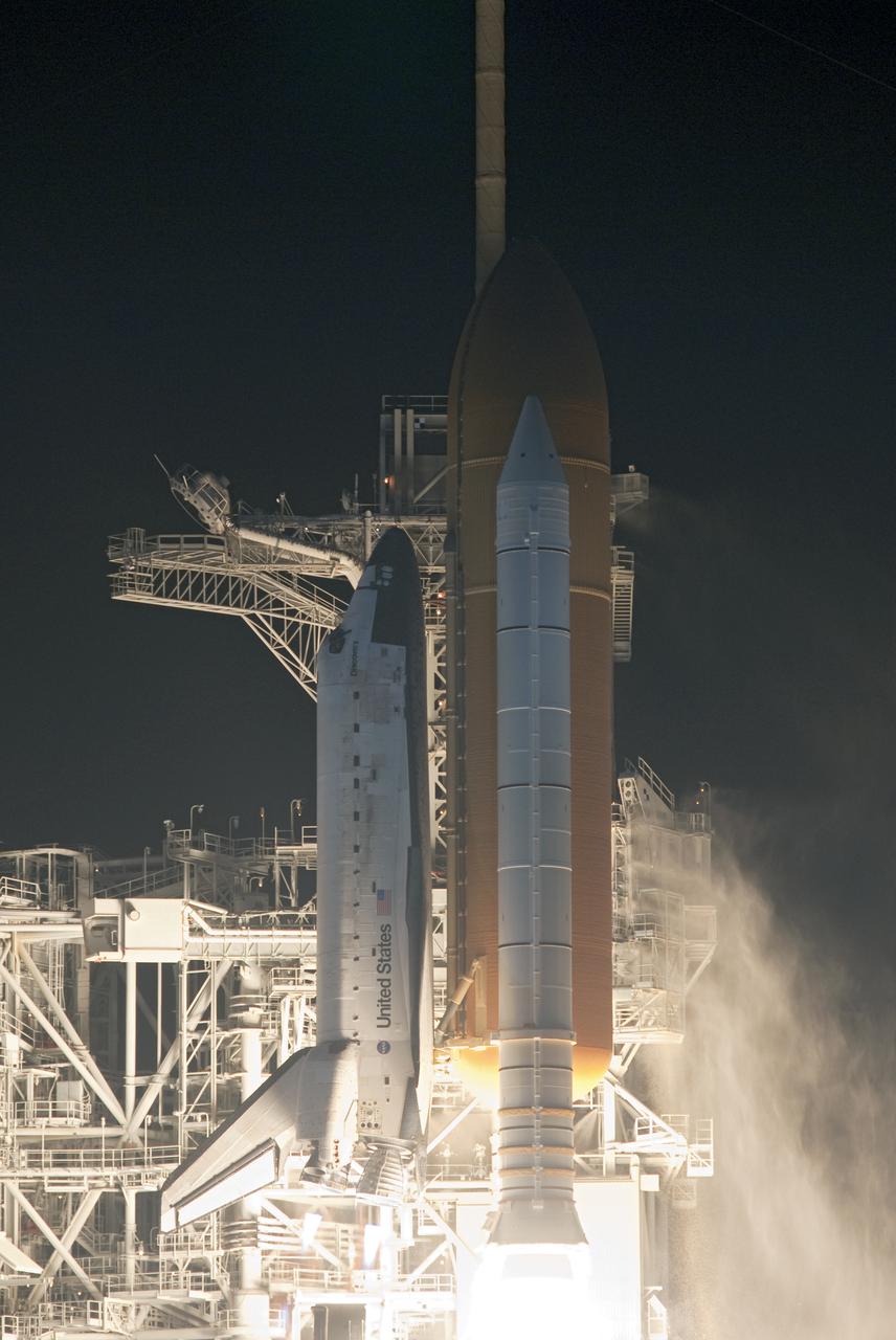 CAPE CANAVERAL, Fla.  - Space shuttle Discovery begins its ascent into the predawn sky over Launch Pad 39A at NASA's Kennedy Space Center in Florida.  Shuttle Discovery lifted off at 6:21 a.m. EDT on April 5, 2010. The seven-member STS-131 crew will deliver the multi-purpose logistics module Leonardo, filled with supplies, a new crew sleeping quarters and science racks that will be transferred to the International Space Station's laboratories. The crew also will switch out a gyroscope on the station’s truss, install a spare ammonia storage tank and retrieve a Japanese experiment from the station’s exterior. STS-131 is the 33rd shuttle mission to the station and the 131st shuttle mission overall. For information on the STS-131 mission and crew, visit http:__www.nasa.gov_mission_pages_shuttle_shuttlemissions_sts131_index.html. Photo credit: NASA_Rusty Backer and Michael Gayle