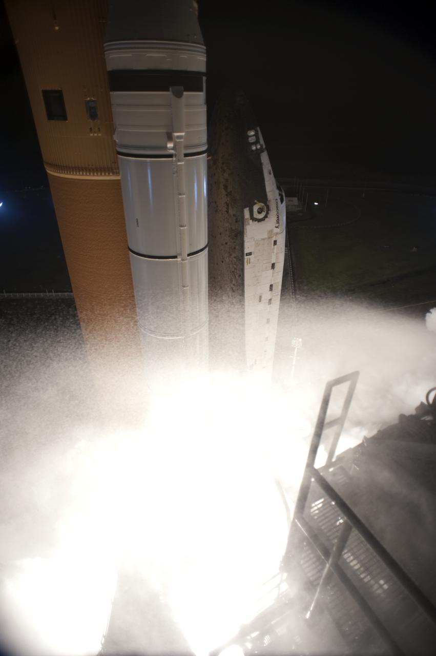 CAPE CANAVERAL, Fla.  - An exhaust cloud billows around Launch Pad 39A at NASA's Kennedy Space Center in Florida as space shuttle Discovery lifts off to begin the STS-131 mission.   Shuttle Discovery lifted off at 6:21 a.m. EDT on April 5, 2010. The seven-member STS-131 crew will deliver the multi-purpose logistics module Leonardo, filled with supplies, a new crew sleeping quarters and science racks that will be transferred to the International Space Station's laboratories. The crew also will switch out a gyroscope on the station’s truss, install a spare ammonia storage tank and retrieve a Japanese experiment from the station’s exterior. STS-131 is the 33rd shuttle mission to the station and the 131st shuttle mission overall. For information on the STS-131 mission and crew, visit http:__www.nasa.gov_mission_pages_shuttle_shuttlemissions_sts131_index.html. Photo credit: NASA_Tony Gray and Tom Farrar