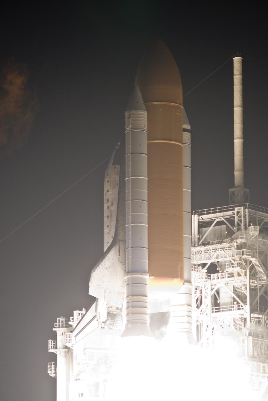 CAPE CANAVERAL, Fla.  - Space shuttle Discovery begins its ascent into the predawn sky over Launch Pad 39A at NASA's Kennedy Space Center in Florida, a radiant start for the STS-131 mission.  Shuttle Discovery lifted off at 6:21 a.m. EDT on April 5, 2010. The seven-member STS-131 crew will deliver the multi-purpose logistics module Leonardo, filled with supplies, a new crew sleeping quarters and science racks that will be transferred to the International Space Station's laboratories. The crew also will switch out a gyroscope on the station’s truss, install a spare ammonia storage tank and retrieve a Japanese experiment from the station’s exterior. STS-131 is the 33rd shuttle mission to the station and the 131st shuttle mission overall. For information on the STS-131 mission and crew, visit http:__www.nasa.gov_mission_pages_shuttle_shuttlemissions_sts131_index.html. Photo credit: NASA_Rusty Backer and Michael Gayle
