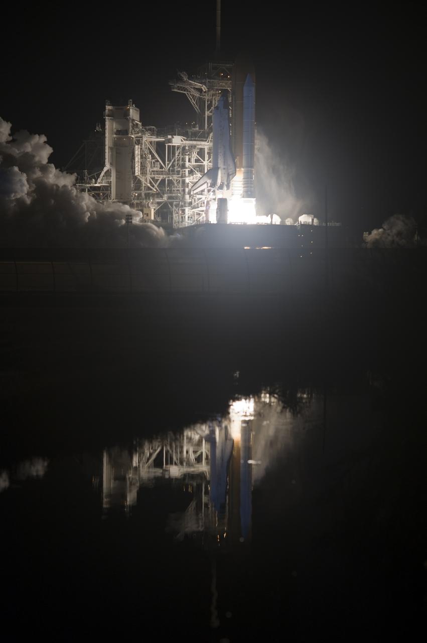 CAPE CANAVERAL, Fla.  - Space shuttle Discovery begins its ascent into the predawn sky past Launch Pad 39A at NASA's Kennedy Space Center in Florida.  Shuttle Discovery lifted off at 6:21 a.m. EDT on April 5, 2010. The seven-member STS-131 crew will deliver the multi-purpose logistics module Leonardo, filled with supplies, a new crew sleeping quarters and science racks that will be transferred to the International Space Station's laboratories. The crew also will switch out a gyroscope on the station’s truss, install a spare ammonia storage tank and retrieve a Japanese experiment from the station’s exterior. STS-131 is the 33rd shuttle mission to the station and the 131st shuttle mission overall. For information on the STS-131 mission and crew, visit http:__www.nasa.gov_mission_pages_shuttle_shuttlemissions_sts131_index.html.  Photo credit: NASA_Tony Gray and Tom Farrar