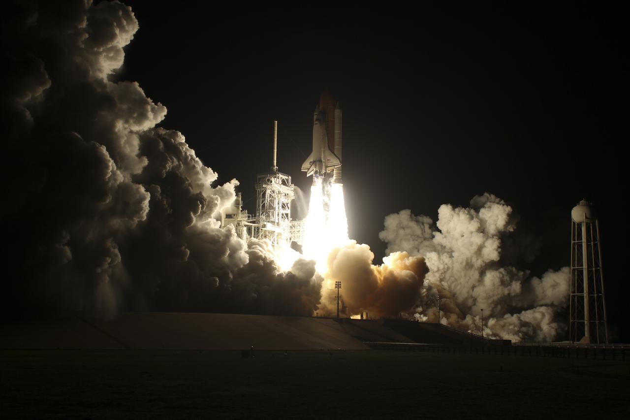 CAPE CANAVERAL, Fla. - The light produced by ignition of the solid rocket boosters and main engines of space shuttle Discovery is dazzling as the shuttle rushes to orbit from Launch Pad 39A at NASA's Kennedy Space Center in Florida.  Liftoff on the STS-131 mission was on time at 6:21 a.m. EDT April 5.  The seven-member crew will deliver the multi-purpose logistics module Leonardo, filled with supplies, a new crew sleeping quarters and science racks that will be transferred to the International Space Station's laboratories.  The crew also will switch out a gyroscope on the station’s truss, install a spare ammonia storage tank and retrieve a Japanese experiment from the station’s exterior.  STS-131 is the 33rd shuttle mission to the station and the 131st shuttle mission overall. For information on the STS-131 mission and crew, visit http:__www.nasa.gov_mission_pages_shuttle_shuttlemissions_sts131_index.html.  Photo courtesy of Scott Andrews