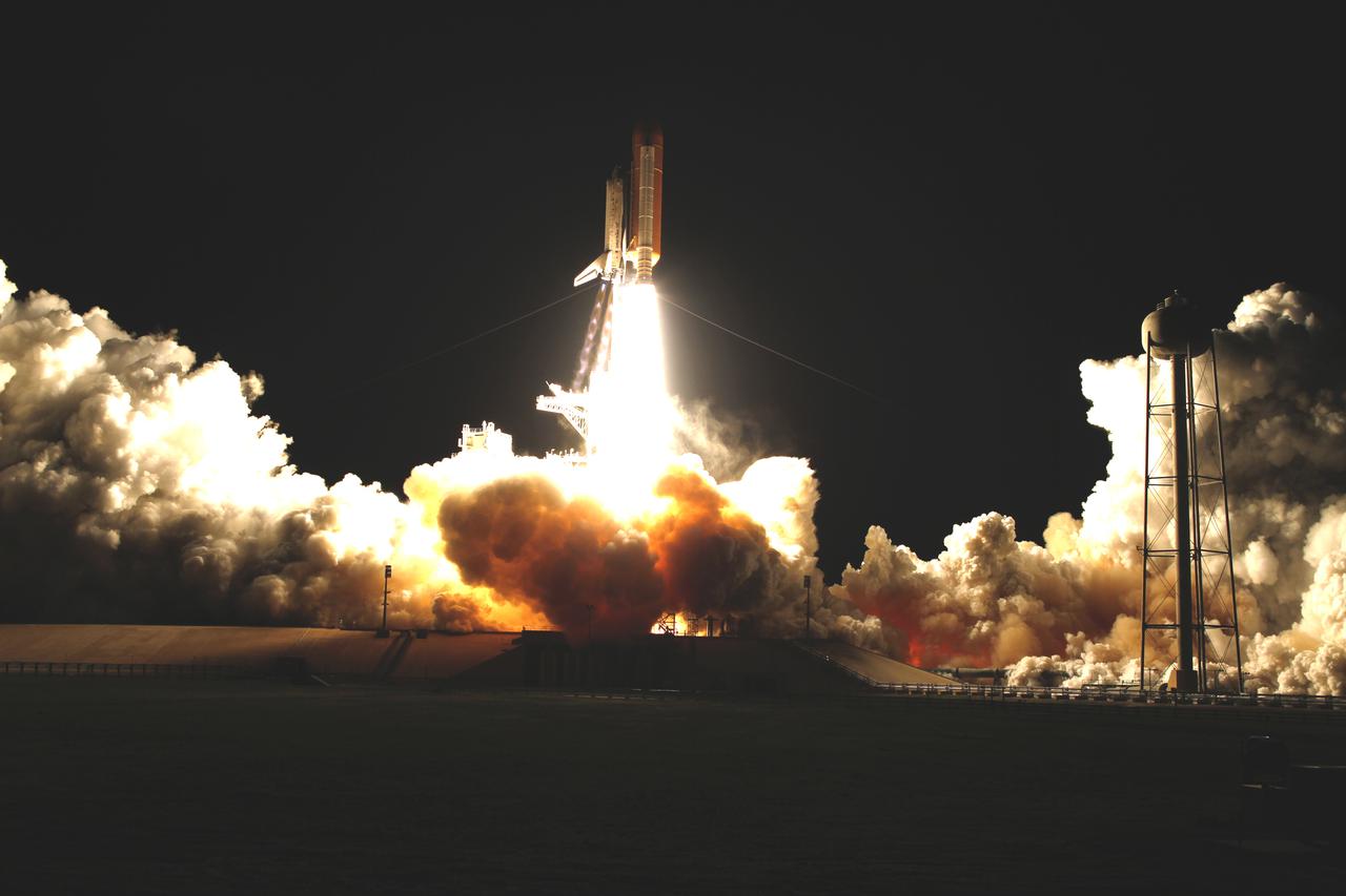 CAPE CANAVERAL, Fla.  Clouds billow around Launch Pad 39A at NASA's Kennedy Space Center in Florida as space shuttle Discovery soars upward on its journey headed for the International Space Station on the STS-131 mission.   Shuttle Discovery lifted off at 6:21 a.m. EDT on April 5, 2010. The seven-member STS-131 crew will deliver the multi-purpose logistics module Leonardo, filled with supplies, a new crew sleeping quarters and science racks that will be transferred to the International Space Station's laboratories. The crew also will switch out a gyroscope on the station’s truss, install a spare ammonia storage tank and retrieve a Japanese experiment from the station’s exterior. STS-131 is the 33rd shuttle mission to the station and the 131st shuttle mission overall. For information on the STS-131 mission and crew, visit http:__www.nasa.gov_mission_pages_shuttle_shuttlemissions_sts131_index.html.  Photo credit: NASA_Sandra Joseph and Kevin O'Connell