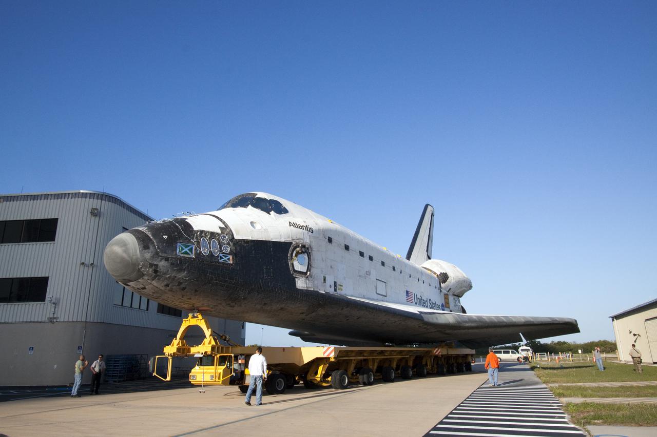 CAPE CANAVERAL, Fla. – At NASA's Kennedy Space Center in Florida, space shuttle Atlantis leaves behind Orbiter Processing Facility-1 on its move to the Vehicle Assembly Building, or VAB, where processing for its upcoming STS-132 mission will continue.  In the VAB, Atlantis will be lifted into a high bay where it will be mated to its external fuel tank and solid rocket boosters.  The six-member STS-132 crew will deliver an Integrated Cargo Carrier, or ICC, and the Russian-built Mini-Research Module-1, or MRM-1, to the International Space Station.  The ICC is an unpressurized flat bed pallet and keel yoke assembly used to support the transfer of exterior cargo from the shuttle to the space station.  The MRM-1, known as Rassvet, is the second in a series of new pressurized components for Russia and will be permanently attached to the Earth-facing port of the Zarya control module. Rassvet, which translates to 'dawn,' will be used for cargo storage and will provide an additional docking port to the station.  STS-132 is the 34th mission to the station and the 132nd shuttle mission overall.   Launch is targeted for May 14.  For information on the STS-132 mission, visit http:__www.nasa.gov_mission_pages_shuttle_shuttlemissions_sts132_index.html. Photo credit: NASA_Jack Pfaller