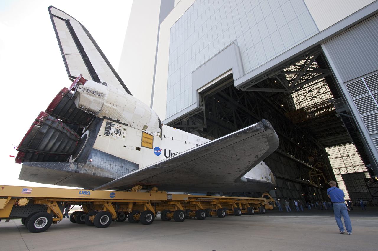 CAPE CANAVERAL, Fla. – At NASA's Kennedy Space Center in Florida, space shuttle Atlantis rolls through the open door of the Vehicle Assembly Building, or VAB, into the transfer aisle. The shuttle is being moved from Orbiter Processing Facility-1 where it was processed for its upcoming STS-132 mission.  In the VAB, Atlantis will be lifted into a high bay where it will be mated to its external fuel tank and solid rocket boosters.  The six-member STS-132 crew will deliver an Integrated Cargo Carrier, or ICC, and the Russian-built Mini-Research Module-1, or MRM-1, to the International Space Station.  The ICC is an unpressurized flat bed pallet and keel yoke assembly used to support the transfer of exterior cargo from the shuttle to the space station.  The MRM-1, known as Rassvet, is the second in a series of new pressurized components for Russia and will be permanently attached to the Earth-facing port of the Zarya control module. Rassvet, which translates to 'dawn,' will be used for cargo storage and will provide an additional docking port to the station.  STS-132 is the 34th mission to the station and the 132nd shuttle mission overall.   Launch is targeted for May 14.  For information on the STS-132 mission, visit http:__www.nasa.gov_mission_pages_shuttle_shuttlemissions_sts132_index.html. Photo credit: NASA_Jack Pfaller
