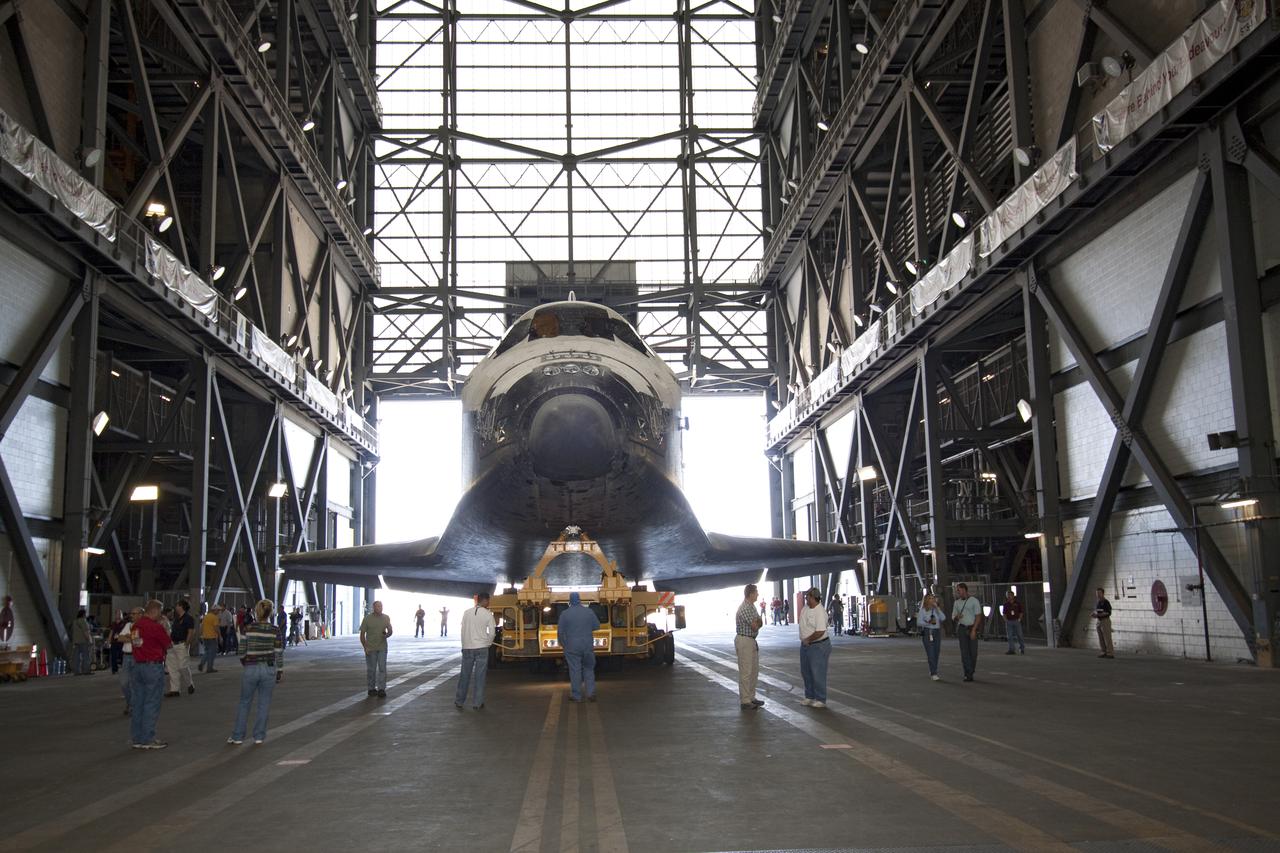 CAPE CANAVERAL, Fla. – At NASA's Kennedy Space Center in Florida, space shuttle Atlantis arrives in the transfer aisle of the Vehicle Assembly Building, or VAB. The shuttle was moved from Orbiter Processing Facility-1 where it was processed for its upcoming STS-132 mission.  In the VAB, Atlantis will be lifted into a high bay where it will be mated to its external fuel tank and solid rocket boosters.  The six-member STS-132 crew will deliver an Integrated Cargo Carrier, or ICC, and the Russian-built Mini-Research Module-1, or MRM-1, to the International Space Station.  The ICC is an unpressurized flat bed pallet and keel yoke assembly used to support the transfer of exterior cargo from the shuttle to the space station.  The MRM-1, known as Rassvet, is the second in a series of new pressurized components for Russia and will be permanently attached to the Earth-facing port of the Zarya control module. Rassvet, which translates to 'dawn,' will be used for cargo storage and will provide an additional docking port to the station.  STS-132 is the 34th mission to the station and the 132nd shuttle mission overall.   Launch is targeted for May 14.  For information on the STS-132 mission, visit http:__www.nasa.gov_mission_pages_shuttle_shuttlemissions_sts132_index.html. Photo credit: NASA_Jack Pfaller
