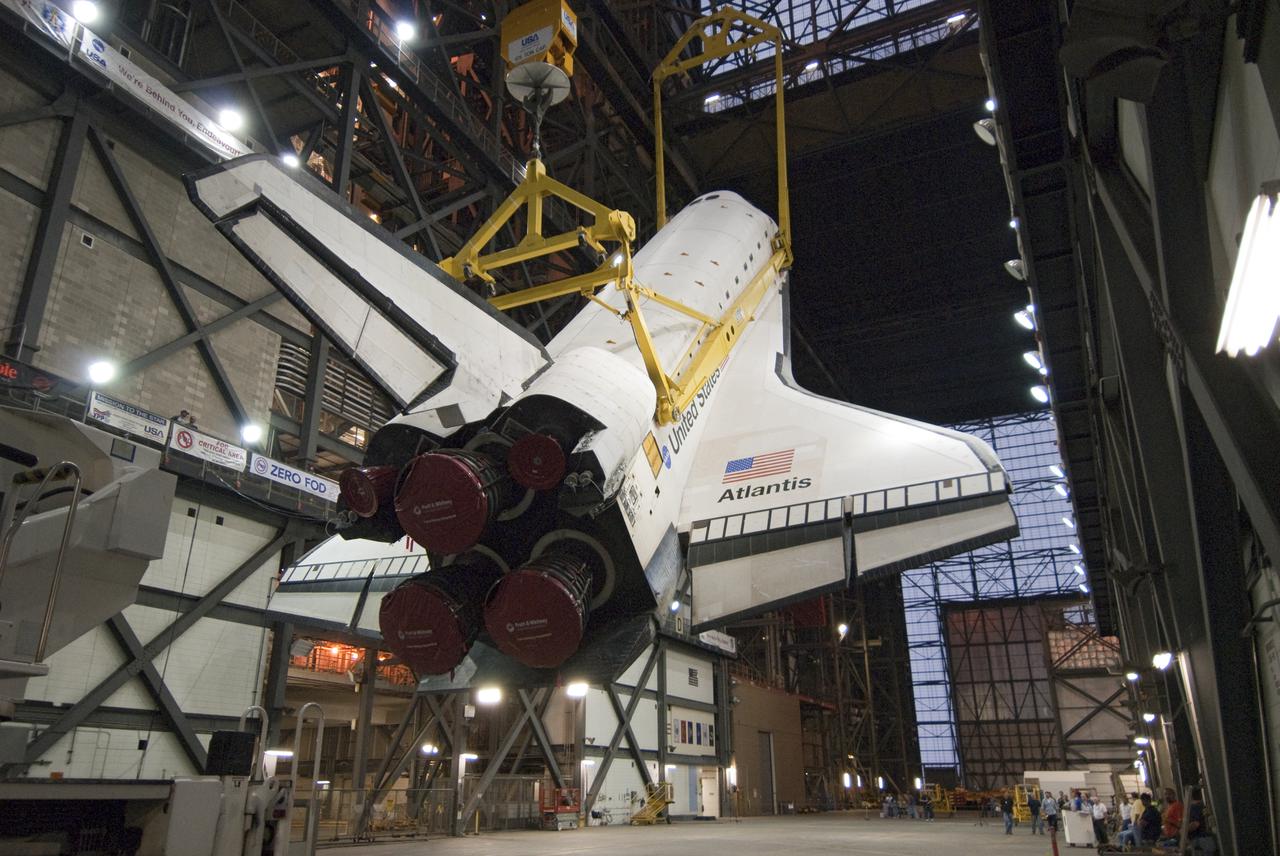 CAPE CANAVERAL, Fla. – In the Vehicle Assembly Building at NASA's Kennedy Space Center in Florida, space shuttle Atlantis appears to take flight from the transfer aisle during its move into High Bay-1. In the bay, Atlantis will be attached to its external fuel tank and solid rocket boosters in preparation for the upcoming STS-132 mission. The six-member STS-132 crew will deliver an Integrated Cargo Carrier, or ICC, and the Russian-built Mini-Research Module-1, or MRM-1, to the International Space Station. The ICC is an unpressurized flat bed pallet and keel yoke assembly used to support the transfer of exterior cargo from the shuttle to the space station. The MRM-1, known as Rassvet, is the second in a series of new pressurized components for Russia and will be permanently attached to the Earth-facing port of the Zarya control module. Rassvet, which translates to 'dawn,' will be used for cargo storage and will provide an additional docking port to the station. STS-132 is the 34th mission to the station and the 132nd shuttle mission overall. Launch is targeted for May 14. For information on the STS-132 mission, visit http:__www.nasa.gov_mission_pages_shuttle_shuttlemissions_sts132_index.html. Photo credit: NASA_Cory Huston