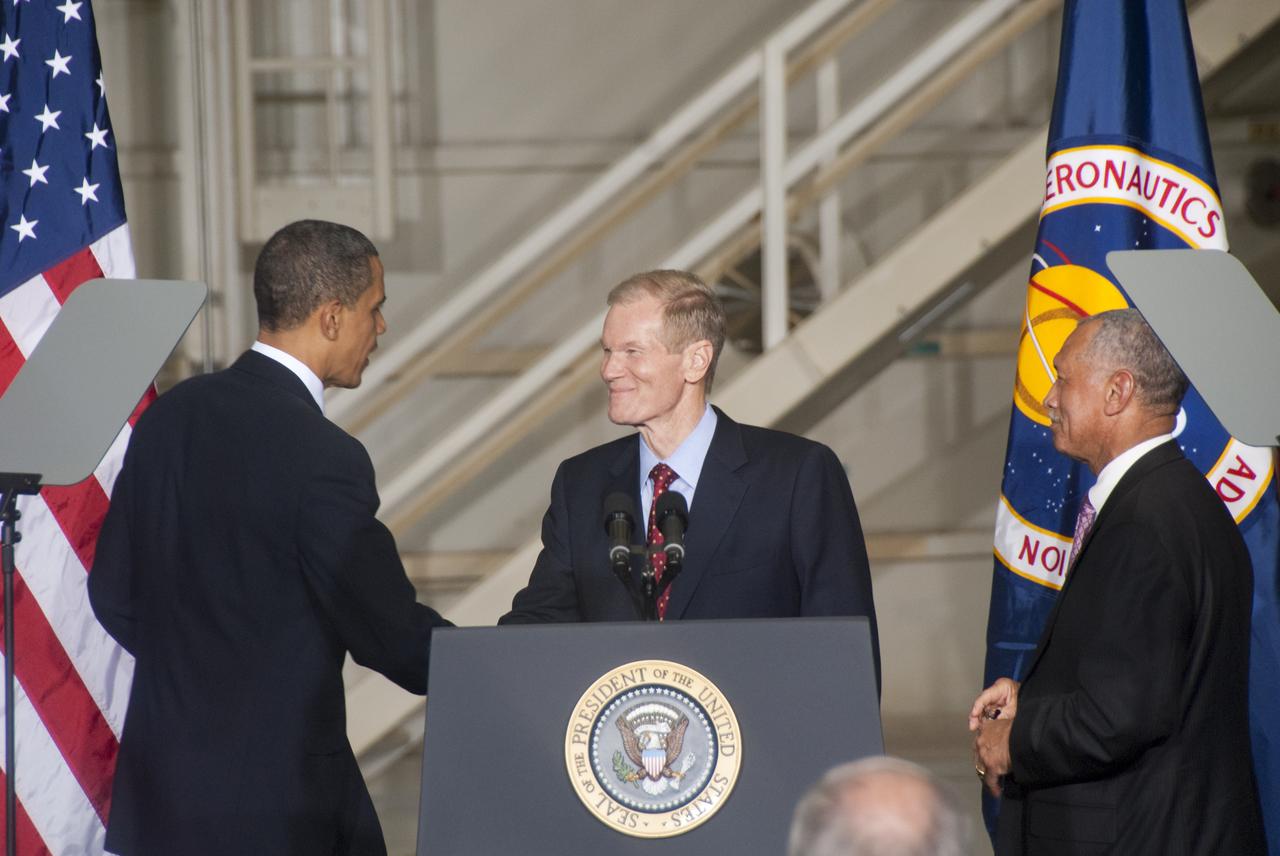CAPE CANAVERAL, Fla. - CAPE CANAVERAL, Fla. - In the Operations and Checkout Building at NASA's Kennedy Space Center in Florida, President Barack Obama greets U.S. Sen. Bill Nelson before addressing the participants of the Conference on the American Space Program for the 21st Century as NASA Administrator Charles Bolden looks on, at right.  In his remarks, President Obama outlined the new course his administration is charting for NASA and the future of U.S. leadership in human spaceflight. Photo credit: NASA_Jim Grossmann