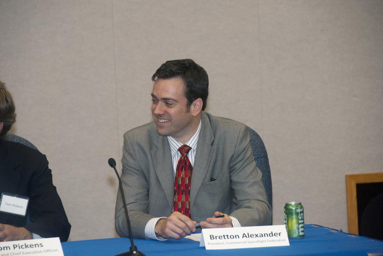 CAPE CANAVERAL, Fla.  - In the mission briefing room of the Operations and Checkout Building at NASA's Kennedy Space Center in Florida, Bretton Alexander, President of the Commercial Spaceflight Federation is enjoying his participation in the second break-out session, 'Increasing Access To and Utilization of the International Space Station,' that is part of the Conference on the American Space Program for the 21st Century. Panel members also include NASA Astronaut Mike Foale; Miles O'Brien, a member of the NASA Advisory Council and panel moderator and Tom Pickens, President and Chief Executive Officer of Astrotech Space Operations. Photo Credit: NASA_Jim Grossmann