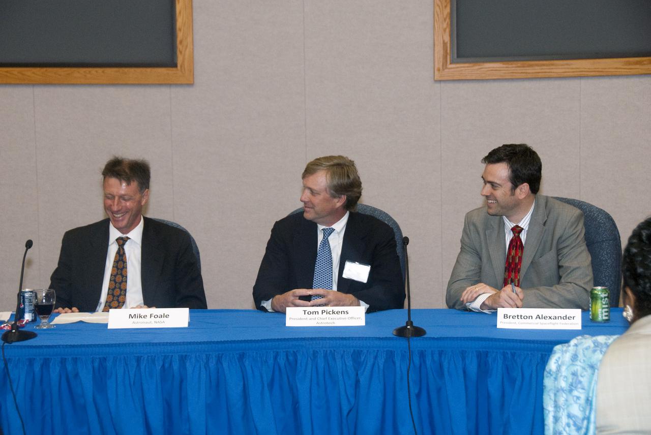 CAPE CANAVERAL, Fla.  - In the mission briefing room of the Operations and Checkout Building at NASA's Kennedy Space Center in Florida, NASA Astronaut Mike Foale (left); Tom Pickens, President and Chief Executive Officer of Astrotech Space Operations; Bretton Alexander, President of the Commercial Spaceflight Federation and Miles O'Brien, a member of the NASA Advisory Council and panel moderator (out of frame) participate in the second break-out session, 'Increasing Access To and Utilization of the International Space Station,' that is part of the Conference on the American Space Program for the 21st Century. Photo Credit: NASA_Jim Grossmann