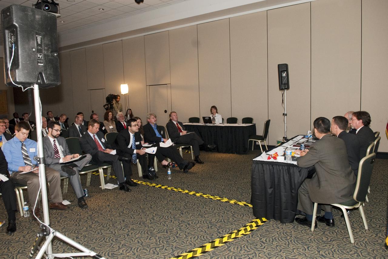 CAPE CANAVERAL, Fla. - In the Vanguard room of the Debus Center at NASA Kennedy Space Center Visitor Complex in Florida, a participant asks a question of the panel during the 'Jumpstarting the New Technologies to Take Us Beyond,' break-out session that is part of the Conference on the American Space Program for the 21st Century. The distinguished panel for this session is: Norman R. Augustine, chair of the Review of U.S. Human Space Flight Plans Committee and panel moderator; Doug Cooke Associate Administrator Exploration Systems for NASA; Robert Braun, NASA Chief Technologist and Ed Lu, Advanced Projects Program Manager for Google. Photo Credit: NASA_Jim Grossmann