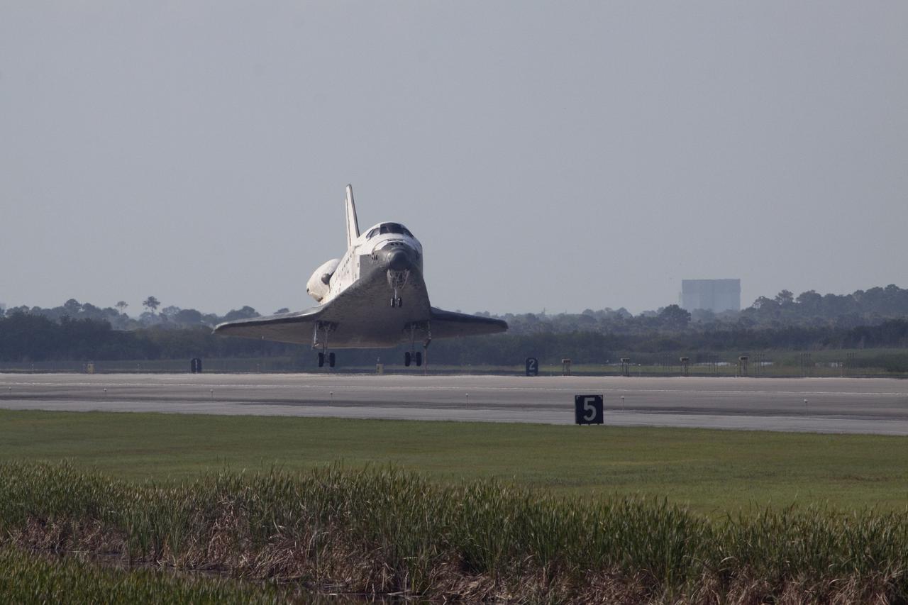 CAPE CANAVERAL, Fla.  - Space shuttle Discovery lands on Runway 33 at the Shuttle Landing Facility at NASA's Kennedy Space Center in Florida at 9:08 a.m. EDT, completing the 15-day STS-131 mission to the International Space Station. Main gear touchdown was at 9:08:35 a.m. EDT followed by nose gear touchdown at 9:08:47 a.m. and wheelstop at 9:09:33 a.m.  Aboard are Commander Alan Poindexter; Pilot James P. Dutton Jr.; and Mission Specialists Rick Mastracchio, Clayton Anderson, Dorothy Metcalf-Lindenburger, Stephanie Wilson and Naoko Yamazaki of the Japan Aerospace Exploration Agency.  The seven-member STS-131 crew carried the multi-purpose logistics module Leonardo, filled with supplies, a new crew sleeping quarters and science racks that were transferred to the International Space Station's laboratories.  The crew also switched out a gyroscope on the station’s truss, installed a spare ammonia storage tank and retrieved a Japanese experiment from the station’s exterior.  STS-131 is the 33rd shuttle mission to the station and the 131st shuttle mission overall. For information on the STS-131 mission and crew, visit http:__www.nasa.gov_mission_pages_shuttle_shuttlemissions_sts131_index.html.  Photo Credit: NASA_Jack Pfaller
