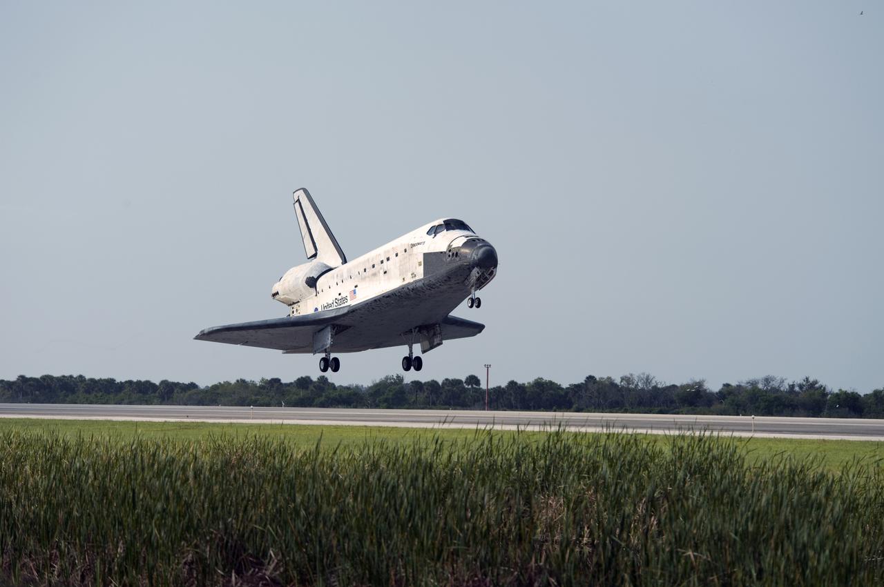 CAPE CANAVERAL, Fla.  - Space shuttle Discovery appears to hover above the ground as it prepares to land on Runway 33 at the Shuttle Landing Facility at NASA's Kennedy Space Center in Florida at 9:08 a.m. EDT, completing the 15-day STS-131 mission to the International Space Station. Main gear touchdown was at 9:08:35 a.m. EDT followed by nose gear touchdown at 9:08:47 a.m. and wheelstop at 9:09:33 a.m.  Aboard are Commander Alan Poindexter; Pilot James P. Dutton Jr.; and Mission Specialists Rick Mastracchio, Clayton Anderson, Dorothy Metcalf-Lindenburger, Stephanie Wilson and Naoko Yamazaki of the Japan Aerospace Exploration Agency.  The seven-member STS-131 crew carried the multi-purpose logistics module Leonardo, filled with supplies, a new crew sleeping quarters and science racks that were transferred to the International Space Station's laboratories.  The crew also switched out a gyroscope on the station’s truss, installed a spare ammonia storage tank and retrieved a Japanese experiment from the station’s exterior.  STS-131 is the 33rd shuttle mission to the station and the 131st shuttle mission overall. For information on the STS-131 mission and crew, visit http:__www.nasa.gov_mission_pages_shuttle_shuttlemissions_sts131_index.html.  Photo Credit: NASA_Thomas Farrar, Jr.