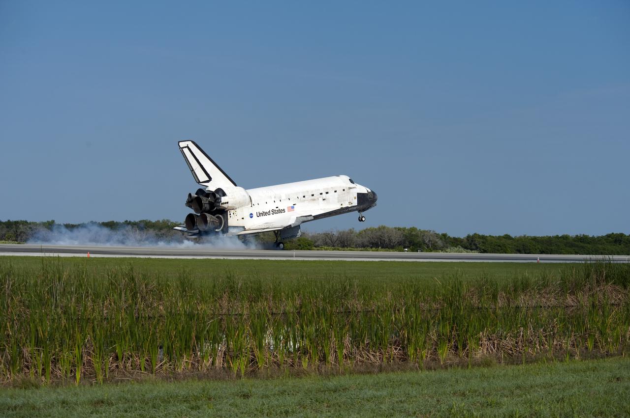 CAPE CANAVERAL, Fla.  - Space shuttle Discovery lands on Runway 33 at the Shuttle Landing Facility at NASA's Kennedy Space Center in Florida at 9:08 a.m. EDT, completing the 15-day STS-131 mission to the International Space Station. Main gear touchdown was at 9:08:35 a.m. EDT followed by nose gear touchdown at 9:08:47 a.m. and wheelstop at 9:09:33 a.m.  Aboard are Commander Alan Poindexter; Pilot James P. Dutton Jr.; and Mission Specialists Rick Mastracchio, Clayton Anderson, Dorothy Metcalf-Lindenburger, Stephanie Wilson and Naoko Yamazaki of the Japan Aerospace Exploration Agency.  The seven-member STS-131 crew carried the multi-purpose logistics module Leonardo, filled with supplies, a new crew sleeping quarters and science racks that were transferred to the International Space Station's laboratories.  The crew also switched out a gyroscope on the station’s truss, installed a spare ammonia storage tank and retrieved a Japanese experiment from the station’s exterior.  STS-131 is the 33rd shuttle mission to the station and the 131st shuttle mission overall. For information on the STS-131 mission and crew, visit http:__www.nasa.gov_mission_pages_shuttle_shuttlemissions_sts131_index.html.  Photo Credit: NASA_Thomas Farrar, Jr.
