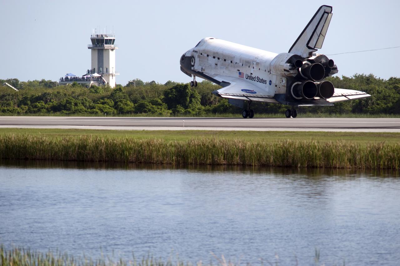 CAPE CANAVERAL, Fla.  - Space shuttle Discovery lands on Runway 33 at the Shuttle Landing Facility at NASA's Kennedy Space Center in Florida at 9:08 a.m. EDT, completing the 15-day STS-131 mission to the International Space Station. The air traffic control tower can be seen in the background. Main gear touchdown was at 9:08:35 a.m. EDT followed by nose gear touchdown at 9:08:47 a.m. and wheelstop at 9:09:33 a.m.  Aboard are Commander Alan Poindexter; Pilot James P. Dutton Jr.; and Mission Specialists Rick Mastracchio, Clayton Anderson, Dorothy Metcalf-Lindenburger, Stephanie Wilson and Naoko Yamazaki of the Japan Aerospace Exploration Agency.  The seven-member STS-131 crew carried the multi-purpose logistics module Leonardo, filled with supplies, a new crew sleeping quarters and science racks that were transferred to the International Space Station's laboratories.  The crew also switched out a gyroscope on the station’s truss, installed a spare ammonia storage tank and retrieved a Japanese experiment from the station’s exterior.  STS-131 is the 33rd shuttle mission to the station and the 131st shuttle mission overall. For information on the STS-131 mission and crew, visit http:__www.nasa.gov_mission_pages_shuttle_shuttlemissions_sts131_index.html.  Photo Credit: NASA_Rusty Backer