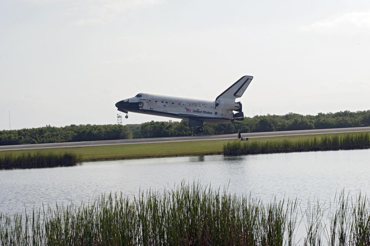 CAPE CANAVERAL, Fla. - Space shuttle Discovery appears to hover above the ground as it nears touchdown on Runway 33 at the Shuttle Landing Facility at NASA's Kennedy Space Center in Florida at 9:08 a.m. EDT, completing the 15-day STS-131 mission to the International Space Station.  Main gear touchdown was at 9:08:35 a.m. EDT followed by nose gear touchdown at 9:08:47 a.m. and wheelstop at 9:09:33 a.m.  Aboard are Commander Alan Poindexter; Pilot James P. Dutton Jr.; and Mission Specialists Rick Mastracchio, Clayton Anderson, Dorothy Metcalf-Lindenburger, Stephanie Wilson and Naoko Yamazaki of the Japan Aerospace Exploration Agency.  The seven-member STS-131 crew carried the multi-purpose logistics module Leonardo, filled with supplies, a new crew sleeping quarters and science racks that were transferred to the International Space Station's laboratories.  The crew also switched out a gyroscope on the station’s truss, installed a spare ammonia storage tank and retrieved a Japanese experiment from the station’s exterior.  STS-131 is the 33rd shuttle mission to the station and the 131st shuttle mission overall. For information on the STS-131 mission and crew, visit http:__www.nasa.gov_mission_pages_shuttle_shuttlemissions_sts131_index.html.  Photo credit: NASA_Chuck Tintera