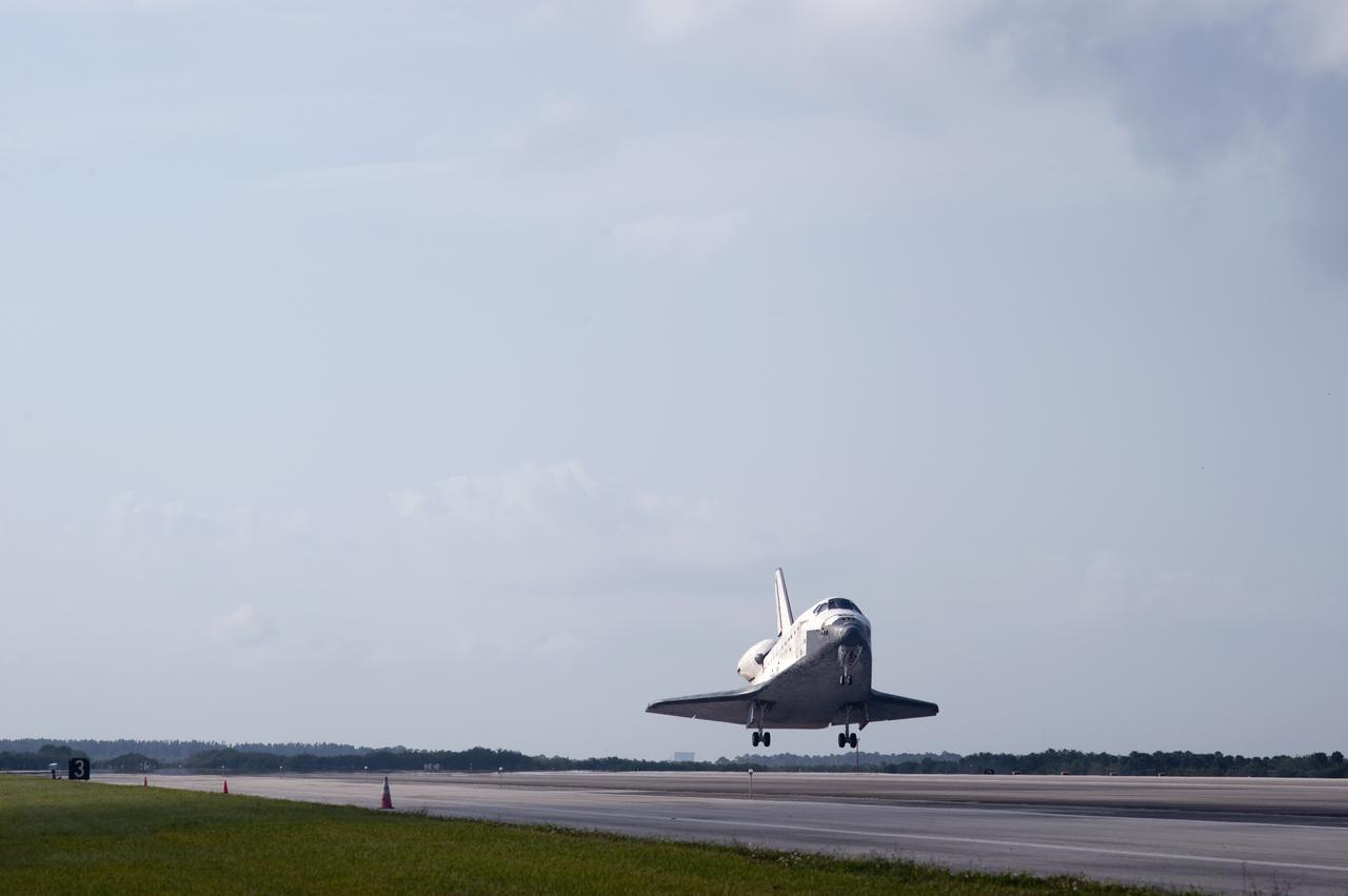 CAPE CANAVERAL, Fla. - Space shuttle Discovery appears to hover above the ground as it nears touchdown on Runway 33 at the Shuttle Landing Facility at NASA's Kennedy Space Center in Florida at 9:08 a.m. EDT, completing the 15-day STS-131 mission to the International Space Station.  Main gear touchdown was at 9:08:35 a.m. EDT followed by nose gear touchdown at 9:08:47 a.m. and wheelstop at 9:09:33 a.m.  Aboard are Commander Alan Poindexter; Pilot James P. Dutton Jr.; and Mission Specialists Rick Mastracchio, Clayton Anderson, Dorothy Metcalf-Lindenburger, Stephanie Wilson and Naoko Yamazaki of the Japan Aerospace Exploration Agency.  The seven-member STS-131 crew carried the multi-purpose logistics module Leonardo, filled with supplies, a new crew sleeping quarters and science racks that were transferred to the International Space Station's laboratories.  The crew also switched out a gyroscope on the station’s truss, installed a spare ammonia storage tank and retrieved a Japanese experiment from the station’s exterior.  STS-131 is the 33rd shuttle mission to the station and the 131st shuttle mission overall. For information on the STS-131 mission and crew, visit http:__www.nasa.gov_mission_pages_shuttle_shuttlemissions_sts131_index.html.  Photo credit: NASA_Tony Gray and Tom Farrar