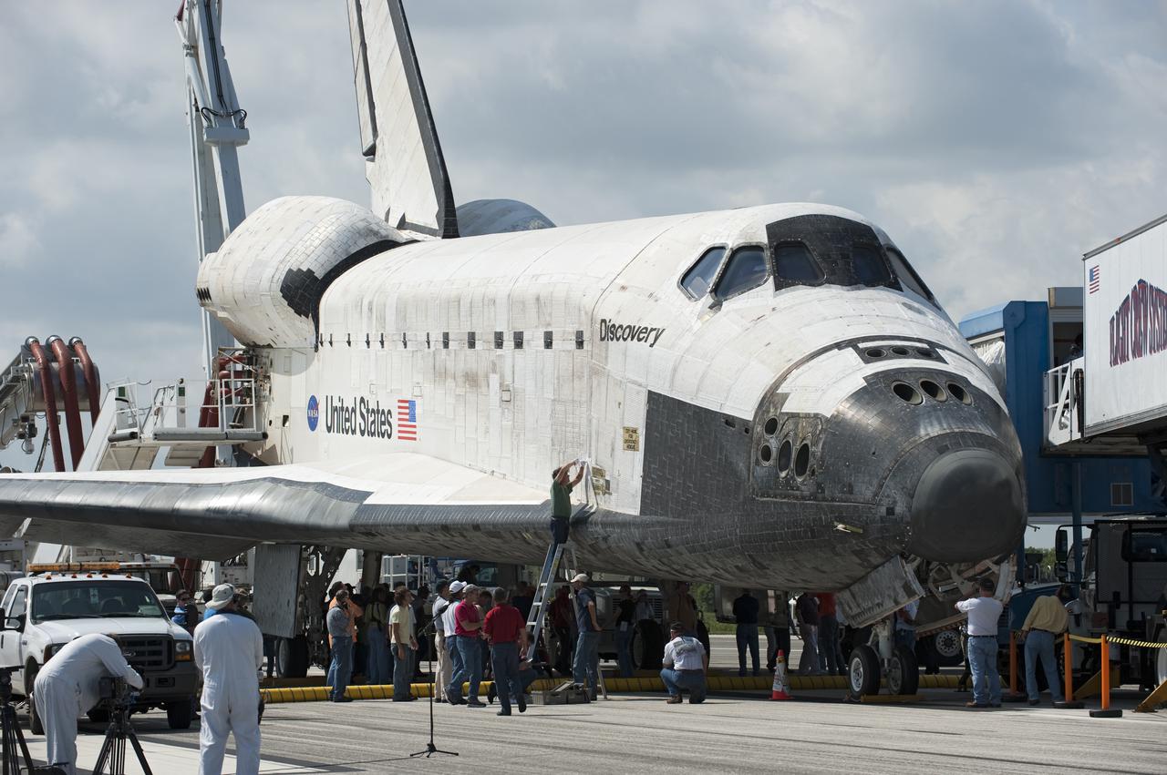 CAPE CANAVERAL, Fla. - At NASA's Kennedy Space Center in Florida, members of the convoy team 'safe' space shuttle Discovery after its landing on Runway 33 at the Shuttle Landing Facility.  Discovery landed at Kennedy after 15 days in space, completing the more than 6.2-million-mile STS-131 mission on orbit 238.  The convoy is made up of about 25 specially designed vehicles and a team of trained personnel who 'safe' the shuttle, prepare it for towing, assist the crew in leaving the shuttle, and finally, tow the shuttle to its hangar.  Main gear touchdown was at 9:08:35 a.m. EDT followed by nose gear touchdown at 9:08:47 a.m. and wheelstop at 9:09:33 a.m.  Aboard are Commander Alan Poindexter; Pilot James P. Dutton Jr.; and Mission Specialists Rick Mastracchio, Clayton Anderson, Dorothy Metcalf-Lindenburger, Stephanie Wilson and Naoko Yamazaki of the Japan Aerospace Exploration Agency.  The seven-member STS-131 crew carried the multi-purpose logistics module Leonardo, filled with supplies, a new crew sleeping quarters and science racks that were transferred to the International Space Station's laboratories.  The crew also switched out a gyroscope on the station’s truss, installed a spare ammonia storage tank and retrieved a Japanese experiment from the station’s exterior.  STS-131 is the 33rd shuttle mission to the station and the 131st shuttle mission overall. For information on the STS-131 mission and crew, visit http:__www.nasa.gov_mission_pages_shuttle_shuttlemissions_sts131_index.html.  Photo credit: NASA_Kevin O'Connell
