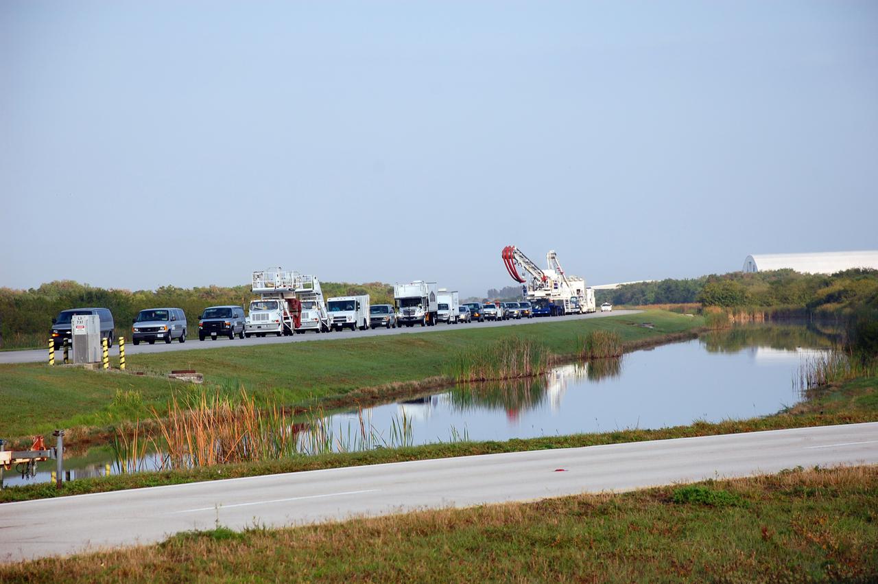 CAPE CANAVERAL, Fla. - At NASA's Kennedy Space Center in Florida, the shuttle convoy vehicles roll to the Shuttle Landing Facility in preparation for the landing of space shuttle Discovery.  The convoy is made up of about 40 vehicles, including 25 specially designed vehicles, and a team of trained personnel who 'safe' the shuttle, prepare it for towing, assist the crew in leaving the shuttle, and finally, tow the shuttle to its hangar.  Discovery landed at Kennedy after 15 days in space, completing the more than 6.2-million-mile STS-131 mission on orbit 238.  Main gear touchdown was at 9:08:35 a.m. EDT followed by nose gear touchdown at 9:08:47 a.m. and wheelstop at 9:09:33 a.m.  Aboard are Commander Alan Poindexter; Pilot James P. Dutton Jr.; and Mission Specialists Rick Mastracchio, Clayton Anderson, Dorothy Metcalf-Lindenburger, Stephanie Wilson and Naoko Yamazaki of the Japan Aerospace Exploration Agency.  The seven-member STS-131 crew carried the multi-purpose logistics module Leonardo, filled with supplies, a new crew sleeping quarters and science racks that were transferred to the International Space Station's laboratories.  The crew also switched out a gyroscope on the station’s truss, installed a spare ammonia storage tank and retrieved a Japanese experiment from the station’s exterior.  STS-131 is the 33rd shuttle mission to the station and the 131st shuttle mission overall. For information on the STS-131 mission and crew, visit http:__www.nasa.gov_mission_pages_shuttle_shuttlemissions_sts131_index.html.  Photo credit: NASA_Ben Smegelsky