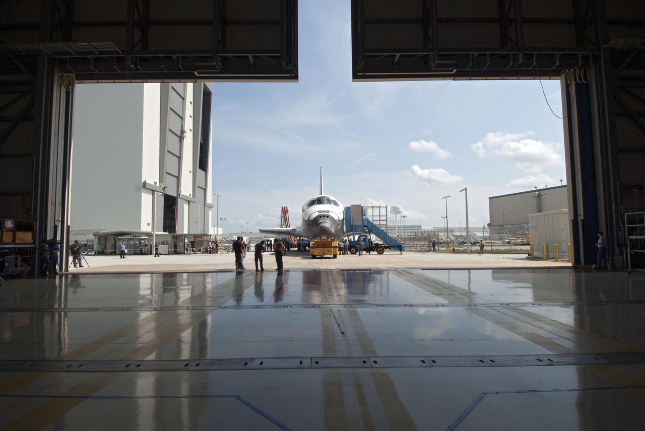 CAPE CANAVERAL, Fla. - At NASA's Kennedy Space Center in Florida, space shuttle Discovery arrives at Orbiter Processing Facility-3 following its successful landing on Runway 33 at the Shuttle Landing Facility.  Discovery landed at Kennedy after 15 days in space, completing the more than 6.2-million-mile STS-131 mission on orbit 238.  Main gear touchdown was at 9:08:35 a.m. EDT followed by nose gear touchdown at 9:08:47 a.m. and wheelstop at 9:09:33 a.m.  Aboard were Commander Alan Poindexter; Pilot James P. Dutton Jr.; and Mission Specialists Rick Mastracchio, Clayton Anderson, Dorothy Metcalf-Lindenburger, Stephanie Wilson and Naoko Yamazaki of the Japan Aerospace Exploration Agency.  The seven-member STS-131 crew carried the multi-purpose logistics module Leonardo, filled with supplies, a new crew sleeping quarters and science racks that were transferred to the International Space Station's laboratories.  The crew also switched out a gyroscope on the station’s truss, installed a spare ammonia storage tank and retrieved a Japanese experiment from the station’s exterior.  STS-131 is the 33rd shuttle mission to the station and the 131st shuttle mission overall. For information on the STS-131 mission and crew, visit http:__www.nasa.gov_mission_pages_shuttle_shuttlemissions_sts131_index.html.  Photo credit: NASA_Jim Grossmann