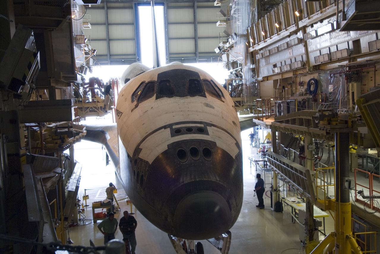 CAPE CANAVERAL, Fla. - At NASA's Kennedy Space Center in Florida, work platforms are positioned around space shuttle Discovery in Orbiter Processing Facility-3.  Discovery was towed into its hangar following its successful landing on Runway 33 at the Shuttle Landing Facility.  Discovery landed at Kennedy after 15 days in space, completing the more than 6.2-million-mile STS-131 mission on orbit 238.  Main gear touchdown was at 9:08:35 a.m. EDT followed by nose gear touchdown at 9:08:47 a.m. and wheelstop at 9:09:33 a.m.  Aboard were Commander Alan Poindexter; Pilot James P. Dutton Jr.; and Mission Specialists Rick Mastracchio, Clayton Anderson, Dorothy Metcalf-Lindenburger, Stephanie Wilson and Naoko Yamazaki of the Japan Aerospace Exploration Agency.  The seven-member STS-131 crew carried the multi-purpose logistics module Leonardo, filled with supplies, a new crew sleeping quarters and science racks that were transferred to the International Space Station's laboratories.  The crew also switched out a gyroscope on the station’s truss, installed a spare ammonia storage tank and retrieved a Japanese experiment from the station’s exterior.  STS-131 is the 33rd shuttle mission to the station and the 131st shuttle mission overall. For information on the STS-131 mission and crew, visit http:__www.nasa.gov_mission_pages_shuttle_shuttlemissions_sts131_index.html.  Photo credit: NASA_Jim Grossmann