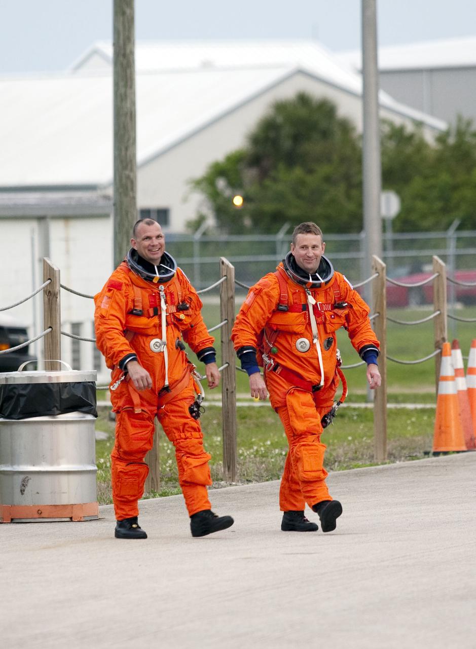 CAPE CANAVERAL, Fla. - At NASA's Kennedy Space Center in Florida, STS-132 Pilot Tony Antonelli, left, and Commander Ken Ham arrive at the Shuttle Landing Facility to practice touch-and-go landings in Shuttle Training Aircraft. The Shuttle Training Aircraft is a Gulfstream II jet, modified to handle like the space shuttle. The STS-132 crew arrived at Kennedy at 6:11 p.m. EDT for their Terminal Countdown Demonstration Test, or TCDT, a dress rehearsal for launch. TCDT provides each shuttle crew and launch team the opportunity to participate in various simulated countdown activities, including equipment familiarization and emergency training. On the STS-132 mission, the six-member crew will deliver an Integrated Cargo Carrier, or ICC, and the Russian-built Mini-Research Module-1, or MRM-1, to the International Space Station aboard space shuttle Atlantis. The ICC is an unpressurized flat bed pallet and keel yoke assembly used to support the transfer of exterior cargo from the shuttle to the space station. The MRM-1, known as Rassvet, is the second in a series of new pressurized components for Russia and will be permanently attached to the Earth-facing port of the Zarya control module. Rassvet, which translates to 'dawn,' will be used for cargo storage and will provide an additional docking port to the station. STS-132 is the 34th mission to the station and the 132nd shuttle mission overall. Atlantis is targeted to launch on May 14 at 2:19 p.m. For information on the STS-132 mission, visit http:__www.nasa.gov_mission_pages_shuttle_shuttlemissions_sts132_index.html. Photo credit: NASA_Troy Cryder