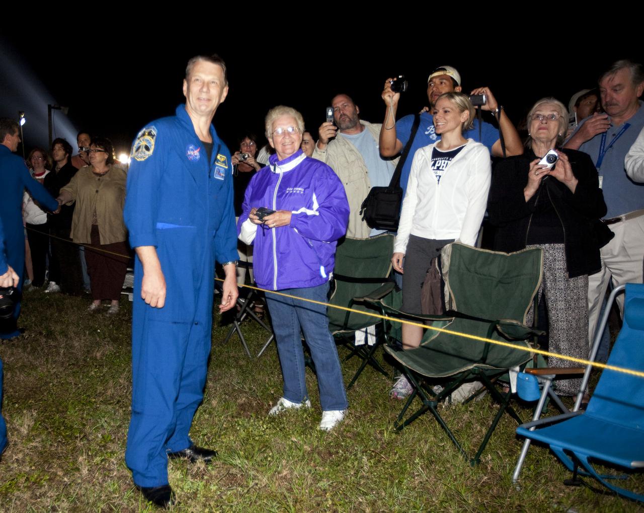 CAPE CANAVERAL, Fla. – Outside the Vehicle Assembly Building at NASA's Kennedy Space Center in Florida, STS-132 Mission Specialist Piers Sellers joins Kennedy employees and their families who turned out to watch space shuttle Atlantis begin its move to Launch Pad 39A. Atlantis' first motion on its 3.4-mile trip from the Vehicle Assembly Building was at 11:31 p.m. EDT April 21. The shuttle was secured on the pad at 6:03 a.m. April 22. Rollout is a significant milestone in launch processing activities. On the STS-132 mission, the six-member crew will deliver an Integrated Cargo Carrier, or ICC, and the Russian-built Mini-Research Module-1, or MRM-1, to the International Space Station. The ICC is an unpressurized flat bed pallet and keel yoke assembly used to support the transfer of exterior cargo from the shuttle to the space station. The MRM-1, known as Rassvet, is the second in a series of new pressurized components for Russia and will be permanently attached to the Earth-facing port of the Zarya control module. Rassvet, which translates to 'dawn,' will be used for cargo storage and will provide an additional docking port to the station. STS-132 is the 34th mission to the station and the 132nd shuttle mission overall. Atlantis is targeted to launch on May 14 at 2:19 p.m. For information on the STS-132 mission, visit http:__www.nasa.gov_mission_pages_shuttle_shuttlemissions_sts132_index.html. Photo credit: NASA_Amanda Diller
