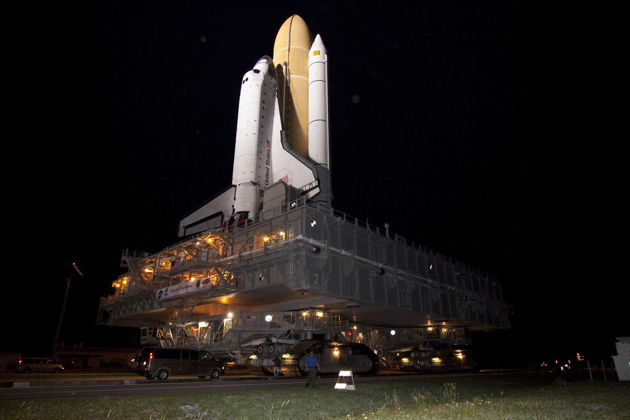 CAPE CANAVERAL, Fla. – At NASA's Kennedy Space Center in Florida, space shuttle Atlantis is in the spotlight as it rolls from the Vehicle Assembly Building to Launch Pad 39A.  Atlantis' first motion on its 3.4-mile trip was at 11:31 p.m. EDT April 21.  The shuttle was secured on the pad at 6:03 a.m. April 22.  Rollout is a significant milestone in launch processing activities.  On the STS-132 mission, the six-member crew will deliver an Integrated Cargo Carrier, or ICC, and the Russian-built Mini-Research Module-1, or MRM-1, to the International Space Station.  The ICC is an unpressurized flat bed pallet and keel yoke assembly used to support the transfer of exterior cargo from the shuttle to the space station.  The MRM-1, known as Rassvet, is the second in a series of new pressurized components for Russia and will be permanently attached to the Earth-facing port of the Zarya control module. Rassvet, which translates to 'dawn,' will be used for cargo storage and will provide an additional docking port to the station.  STS-132 is the 34th mission to the station and the 132nd shuttle mission overall.   Atlantis is targeted to launch on May 14 at 2:19 p.m.  For information on the STS-132 mission, visit http:__www.nasa.gov_mission_pages_shuttle_shuttlemissions_sts132_index.html. Photo credit: NASA_Jack Pfaller