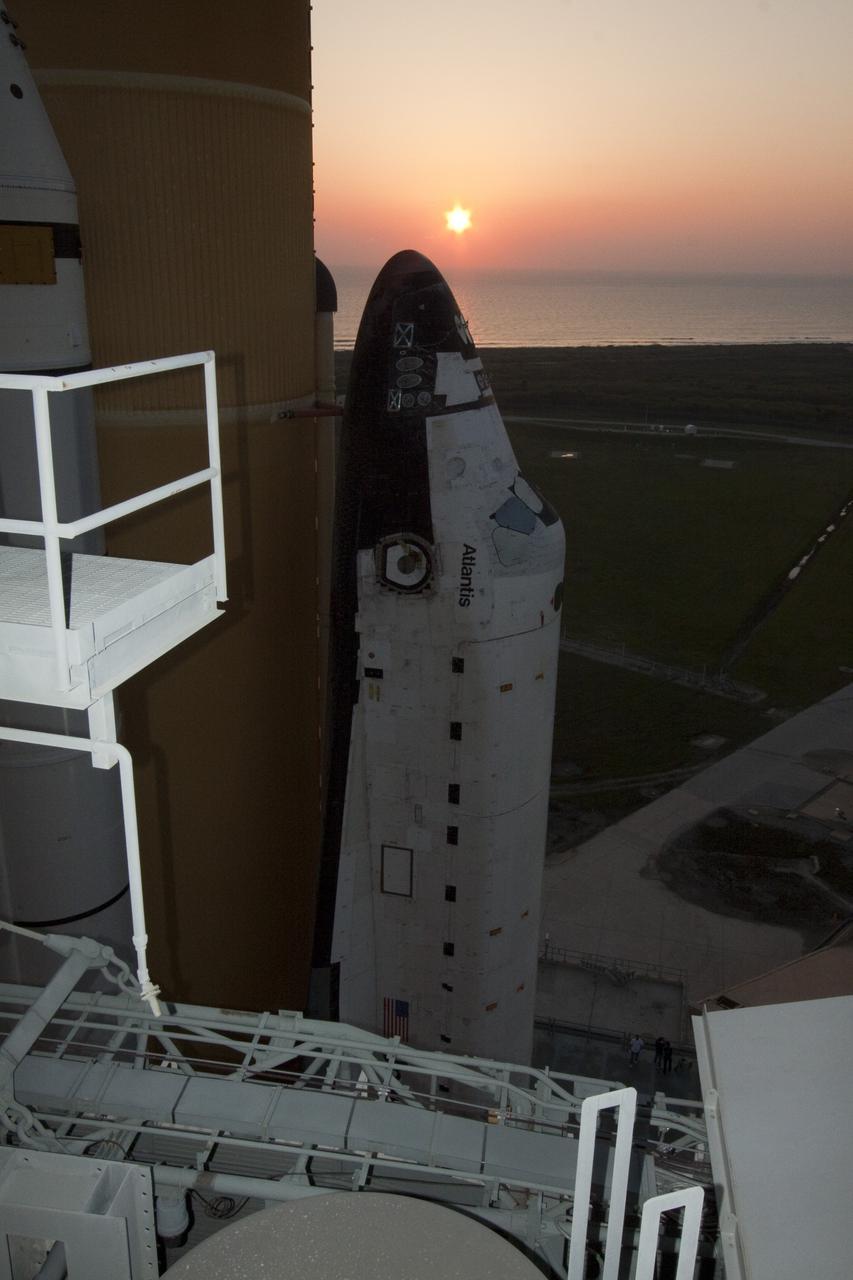 CAPE CANAVERAL, Fla. – The sun rises over the Atlantic Ocean near Launch Pad 39A at NASA's Kennedy Space Center in Florida.  Space shuttle Atlantis was transferred from the Vehicle Assembly Building to the pad overnight for its upcoming launch.  Atlantis' first motion on its 3.4-mile trip was at 11:31 p.m. EDT April 21.  The shuttle was secured, or 'hard down,' on the pad at 6:03 a.m. April 22.  Rollout is a significant milestone in launch processing activities.  On the STS-132 mission, the six-member crew will deliver an Integrated Cargo Carrier, or ICC, and the Russian-built Mini-Research Module-1, or MRM-1, to the International Space Station.  The ICC is an unpressurized flat bed pallet and keel yoke assembly used to support the transfer of exterior cargo from the shuttle to the space station.  The MRM-1, known as Rassvet, is the second in a series of new pressurized components for Russia and will be permanently attached to the Earth-facing port of the Zarya control module. Rassvet, which translates to 'dawn,' will be used for cargo storage and will provide an additional docking port to the station.  STS-132 is the 34th mission to the station and the 132nd shuttle mission overall.   Atlantis is targeted to launch on May 14 at 2:19 p.m.  For information on the STS-132 mission, visit http:__www.nasa.gov_mission_pages_shuttle_shuttlemissions_sts132_index.html. Photo credit: NASA_Jack Pfaller