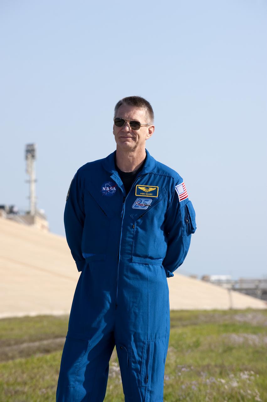 CAPE CANAVERAL, Fla. - At Launch Pad 39A at NASA's Kennedy Space Center in Florida, STS-132 Mission Specialist Piers Sellers participates in a question-and-answer session with media representatives. The crew is at Kennedy for their Terminal Countdown Demonstration Test, or TCDT, a dress rehearsal for launch. TCDT provides each shuttle crew and launch team the opportunity to participate in various simulated countdown activities, including equipment familiarization and emergency training. On the STS-132 mission, the six-member crew will deliver an Integrated Cargo Carrier, or ICC, and the Russian-built Mini-Research Module-1, or MRM-1, to the International Space Station aboard space shuttle Atlantis. The ICC is an unpressurized flat bed pallet and keel yoke assembly used to support the transfer of exterior cargo from the shuttle to the space station. The MRM-1, known as Rassvet, is the second in a series of new pressurized components for Russia and will be permanently attached to the Earth-facing port of the Zarya control module. Rassvet, which translates to 'dawn,' will be used for cargo storage and will provide an additional docking port to the station. STS-132 is the 34th mission to the station and the 132nd shuttle mission overall. Atlantis is targeted to launch on May 14 at 2:19 p.m. For information on the STS-132 mission, visit http:__www.nasa.gov_mission_pages_shuttle_shuttlemissions_sts132_index.html. Photo credit: NASA_Kim Shiflett