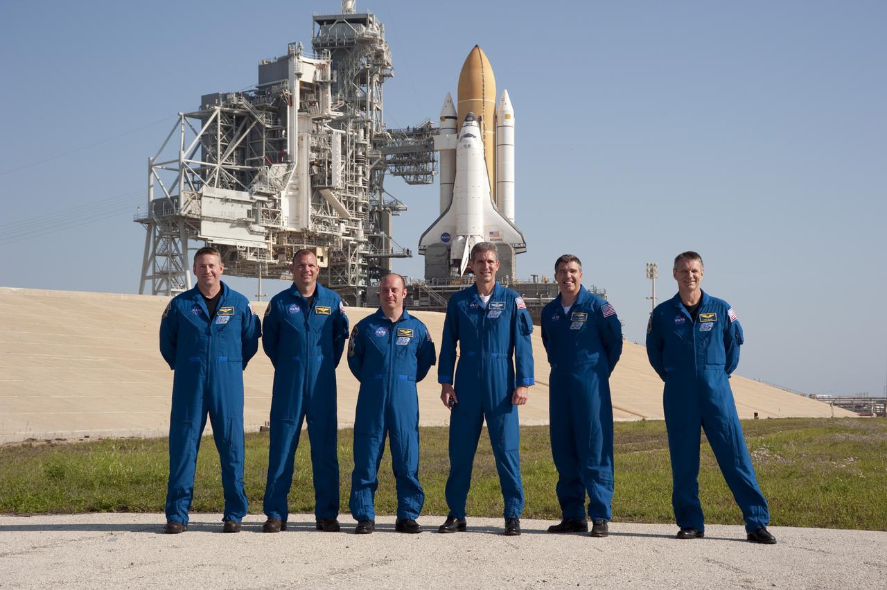 CAPE CANAVERAL, Fla. - At Launch Pad 39A at NASA's Kennedy Space Center in Florida, the STS-132 crew poses for a group portrait following a question-and-answer session with media representatives. From left are Commander Ken Ham; Pilot Tony Antonelli; and Mission Specialists Garrett Reisman, Michael Good, Steve Bowen and Piers Sellers. The crew is at Kennedy for their Terminal Countdown Demonstration Test, or TCDT, a dress rehearsal for launch. TCDT provides each shuttle crew and launch team the opportunity to participate in various simulated countdown activities, including equipment familiarization and emergency training. On the STS-132 mission, the six-member crew will deliver an Integrated Cargo Carrier, or ICC, and the Russian-built Mini-Research Module-1, or MRM-1, to the International Space Station aboard space shuttle Atlantis. The ICC is an unpressurized flat bed pallet and keel yoke assembly used to support the transfer of exterior cargo from the shuttle to the space station. The MRM-1, known as Rassvet, is the second in a series of new pressurized components for Russia and will be permanently attached to the Earth-facing port of the Zarya control module. Rassvet, which translates to 'dawn,' will be used for cargo storage and will provide an additional docking port to the station. STS-132 is the 34th mission to the station and the 132nd shuttle mission overall. Atlantis is targeted to launch on May 14 at 2:19 p.m. For information on the STS-132 mission, visit http:__www.nasa.gov_mission_pages_shuttle_shuttlemissions_sts132_index.html. Photo credit: NASA_Kim Shiflett