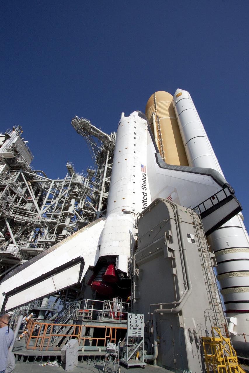 CAPE CANAVERAL, Fla. – On Launch Pad 39A at NASA's Kennedy Space Center in Florida, space shuttle Atlantis, attached to its external fuel tank and solid rocket boosters, towers above the surface of the mobile launcher platform on which it is secured.  From the top of the platform to the tip of the tank is approximately 184 feet.  Atlantis' first motion on its 3.4-mile trip from the Vehicle Assembly Building was at 11:31 p.m. EDT April 21.  The shuttle was secured, or 'hard down,' on the pad at 6:03 a.m. April 22.  Rollout is a significant milestone in launch processing activities.  On the STS-132 mission, the six-member crew will deliver an Integrated Cargo Carrier, or ICC, and the Russian-built Mini-Research Module-1, or MRM-1, to the International Space Station.  The ICC is an unpressurized flat bed pallet and keel yoke assembly used to support the transfer of exterior cargo from the shuttle to the space station.  The MRM-1, known as Rassvet, is the second in a series of new pressurized components for Russia and will be permanently attached to the Earth-facing port of the Zarya control module. Rassvet, which translates to 'dawn,' will be used for cargo storage and will provide an additional docking port to the station.  STS-132 is the 34th mission to the station and the 132nd shuttle mission overall.   Atlantis is targeted to launch on May 14 at 2:19 p.m.  For information on the STS-132 mission, visit http:__www.nasa.gov_mission_pages_shuttle_shuttlemissions_sts132_index.html. Photo credit: NASA_Jack Pfaller