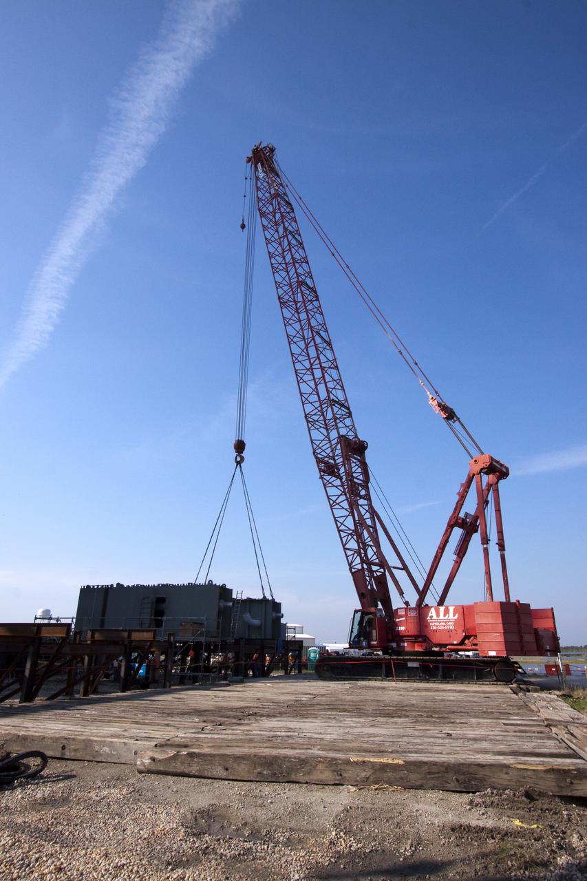 CAPE CANAVERAL, Fla. – At NASA's Kennedy Space Center in Florida, preparations are under way for the arrival of the third segment of the launch mount for a new mobile launcher, or ML, being constructed to support NASA's future human spaceflight program.  The construction is taking place in the mobile launcher park site north of Kennedy's Vehicle Assembly Building.  The new launcher is 355 feet tall and has multiple platforms for personnel access. The base of the launcher is lighter than space shuttle mobile launcher platforms so the crawler-transporter can pick up the heavier load of the tower and a taller rocket. For information on NASA's future plans, visit http:__www.nasa.gov. Photo credit: NASA_Jack Pfaller