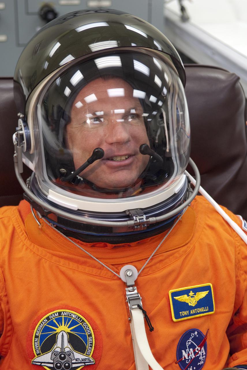 CAPE CANAVERAL, Fla. - In the Operations and Checkout Building at NASA's Kennedy Space Center in Florida, STS-132 Pilot Tony Antonelli verifies that his space suit's helmet is functioning properly. STS-132 is Antonelli's second spaceflight. The six-member STS-132 crew is at Kennedy for their Terminal Countdown Demonstration Test, or TCDT, a dress rehearsal for launch. Following this practice 'suit-up,' the astronauts will ride in the Astrovan to Launch Pad 39A where they will participate in a simulated launch countdown from their seats inside space shuttle Atlantis. Launch is targeted for 2:19 p.m. EDT on May 14. On the STS-132 mission, the crew will deliver an Integrated Cargo Carrier, or ICC, and the Russian-built Mini-Research Module-1, or MRM-1, to the International Space Station. The ICC is an unpressurized flat bed pallet and keel yoke assembly used to support the transfer of exterior cargo from the shuttle to the space station. The MRM-1, known as Rassvet, is the second in a series of new pressurized components for Russia and will be permanently attached to the Earth-facing port of the Zarya control module. Rassvet, which translates to 'dawn,' will be used for cargo storage and provide an additional docking port to the station. STS-132 is the 34th mission to the station and the 132nd shuttle mission overall. For information on the STS-132 mission, visit http:__www.nasa.gov_mission_pages_shuttle_shuttlemissions_sts132_index.html. Photo credit: NASA_Cory Huston